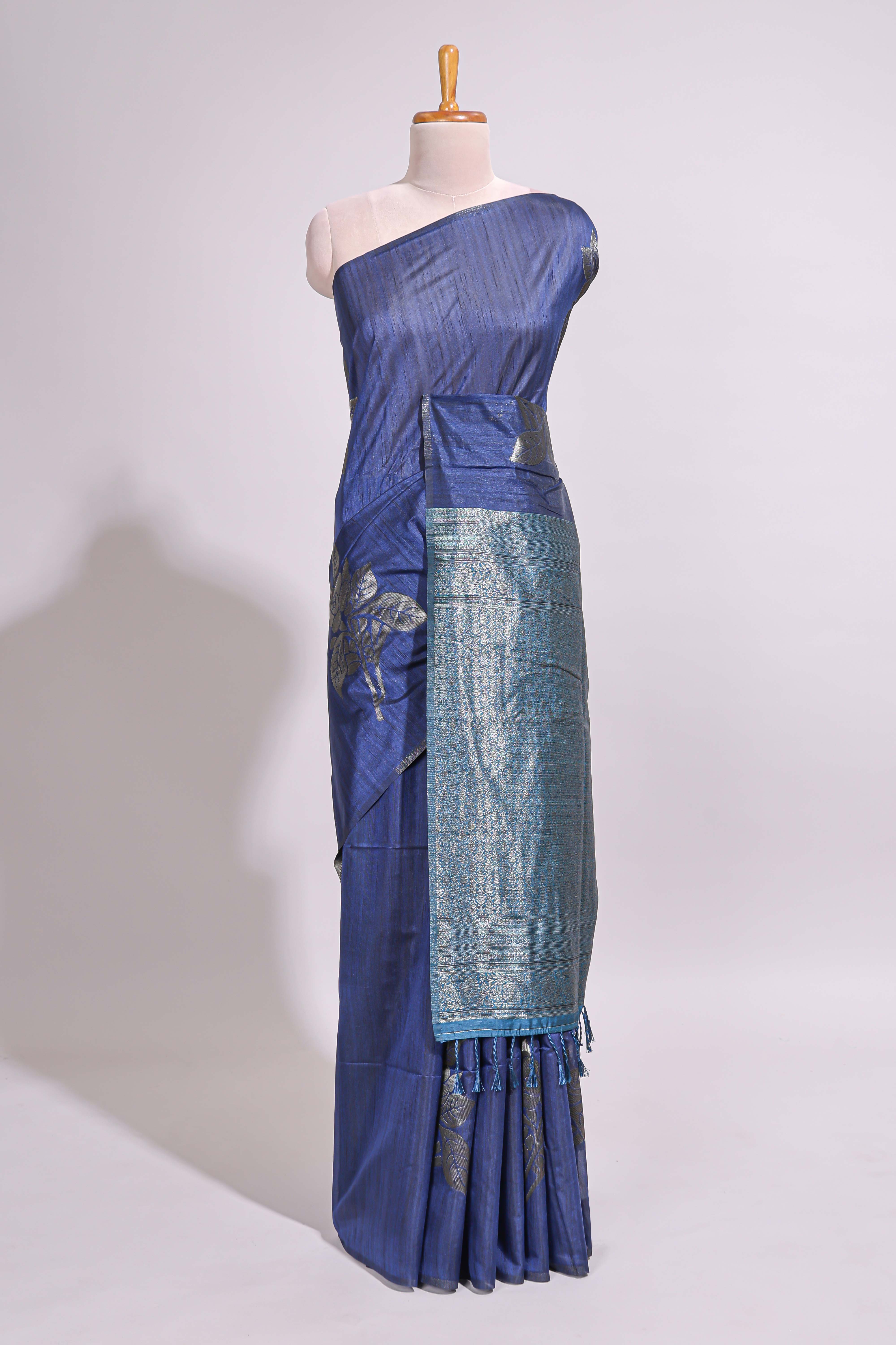 Borderless floral design blue art tussar saree with contrast pallu and silver motifs blouse