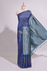 Borderless floral design blue art tussar saree with contrast pallu and silver motifs blouse