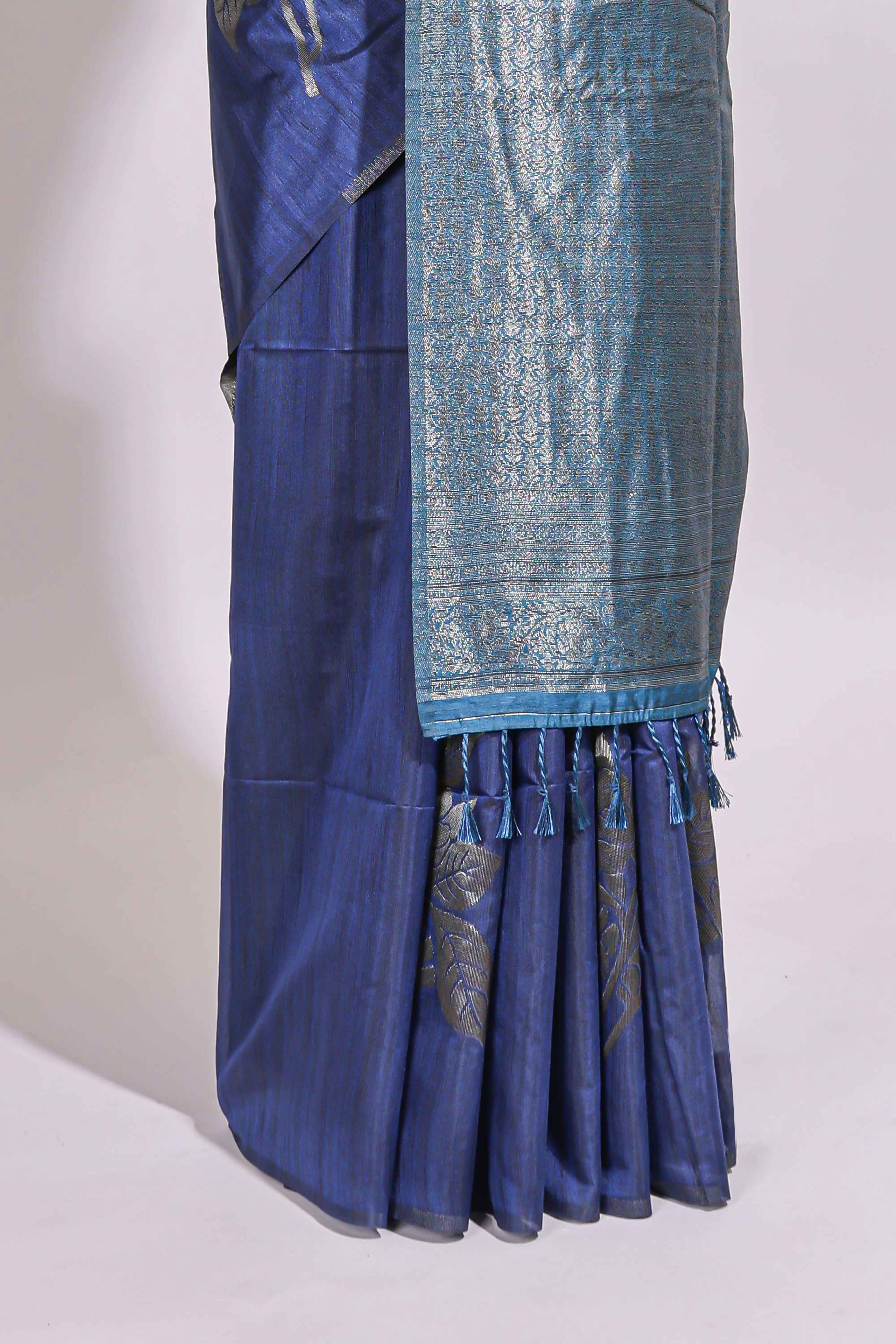Borderless floral design blue art tussar saree with contrast pallu and silver motifs blouse