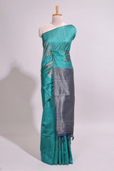 Borderless floral design green art tussar saree with contrast pallu and silver motifs blouse