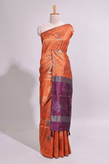 Borderless orange floral design art tusser saree with contrast pallu and floral motifs blouse