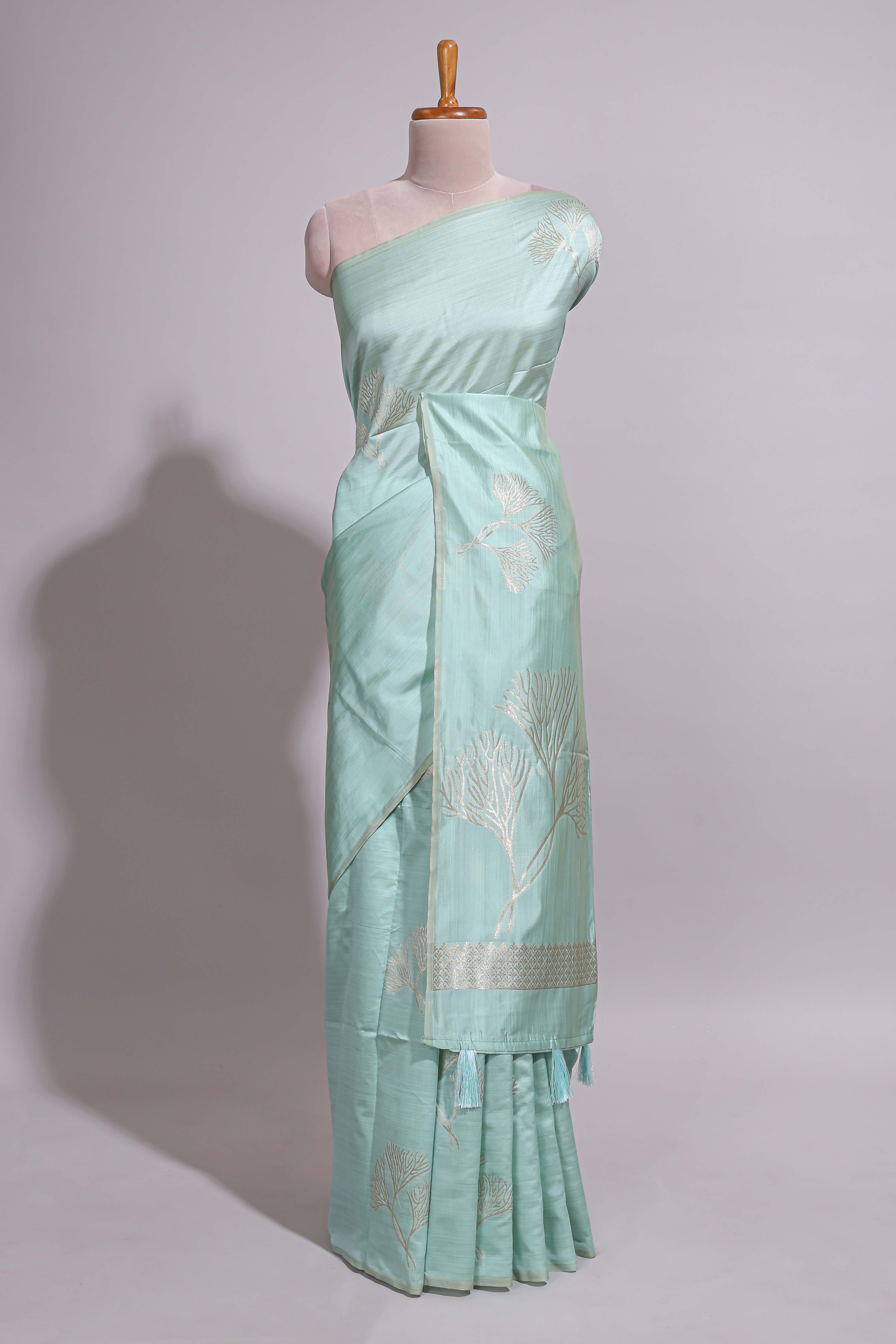 Green zari floral design art tusser saree with self zari border and matching floral motits blouse