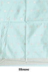 Green zari floral design art tusser saree with self zari border and matching floral motits blouse