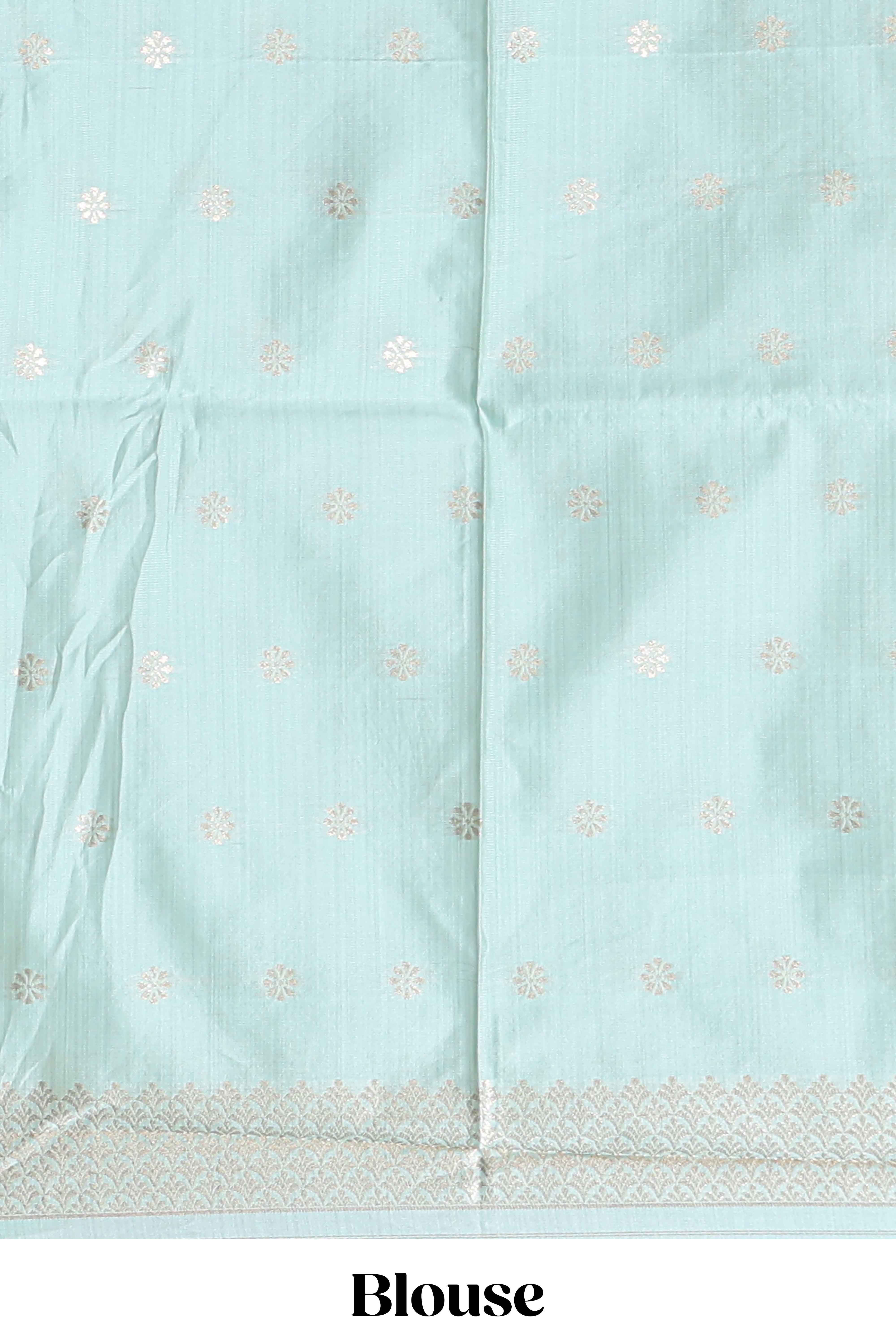 Green zari floral design art tusser saree with self zari border and matching floral motits blouse