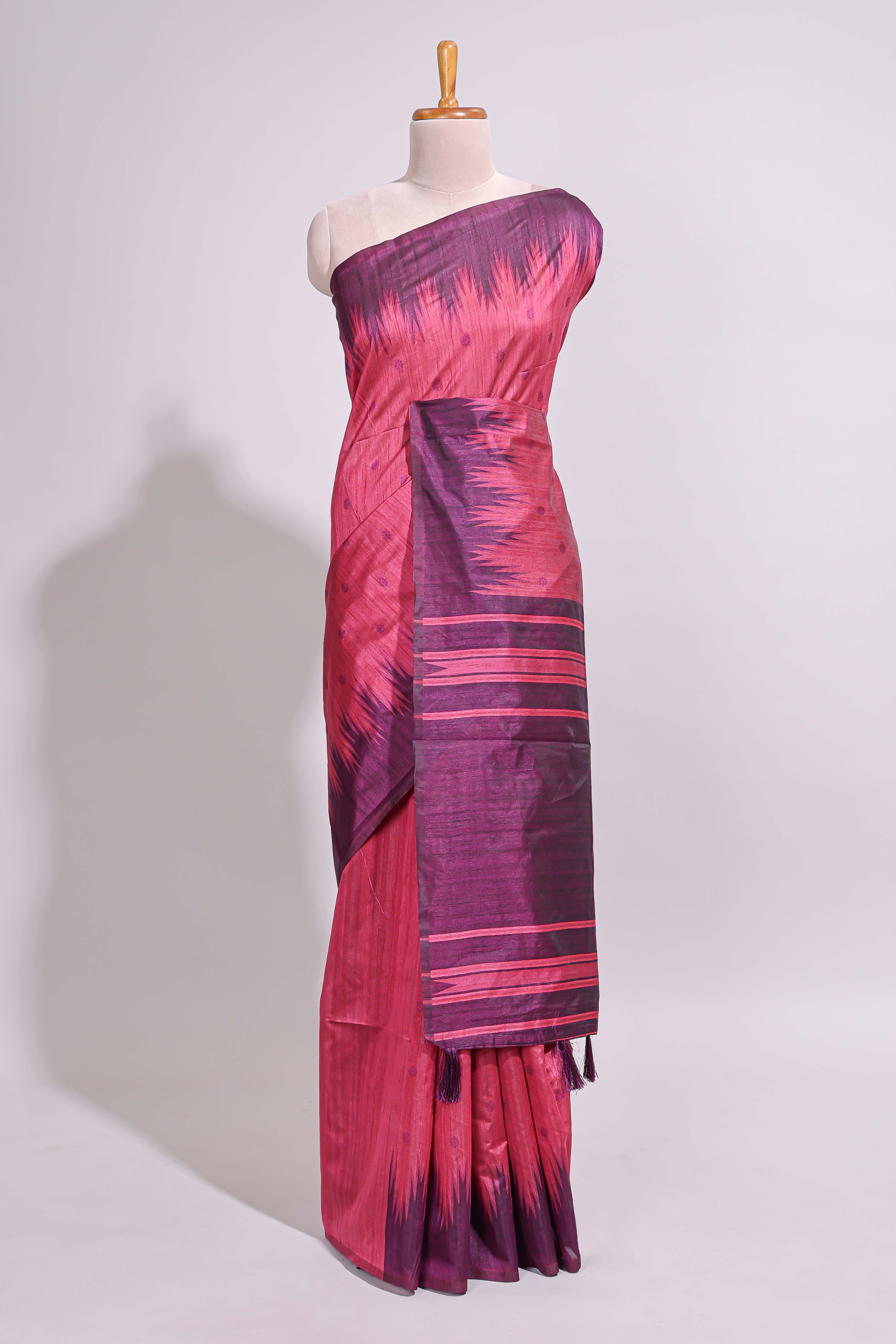 Deep pink textured floral motifs art tussar saree with contrast temple spire border and motifs blouse