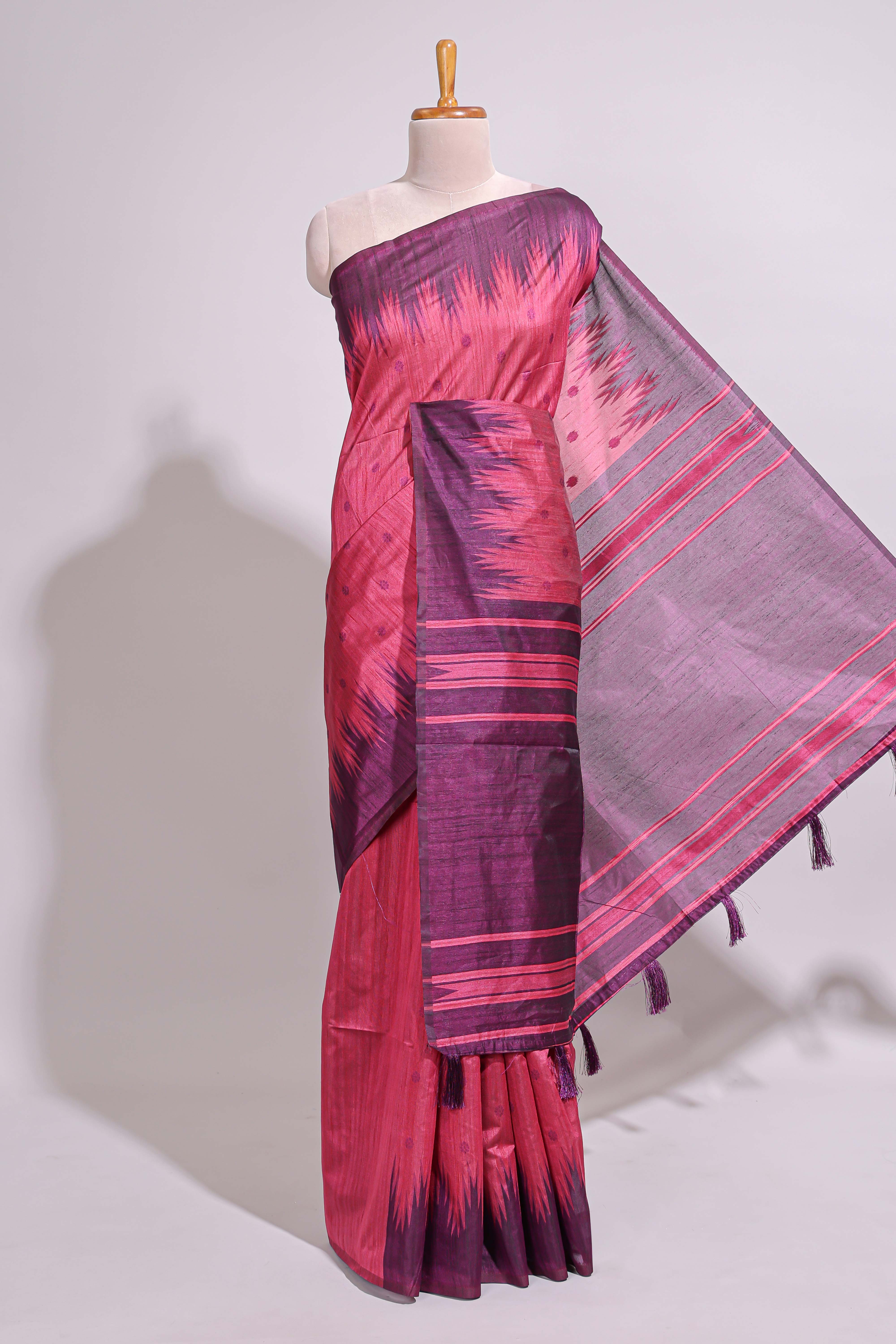 Deep pink textured floral motifs art tussar saree with contrast temple spire border and motifs blouse