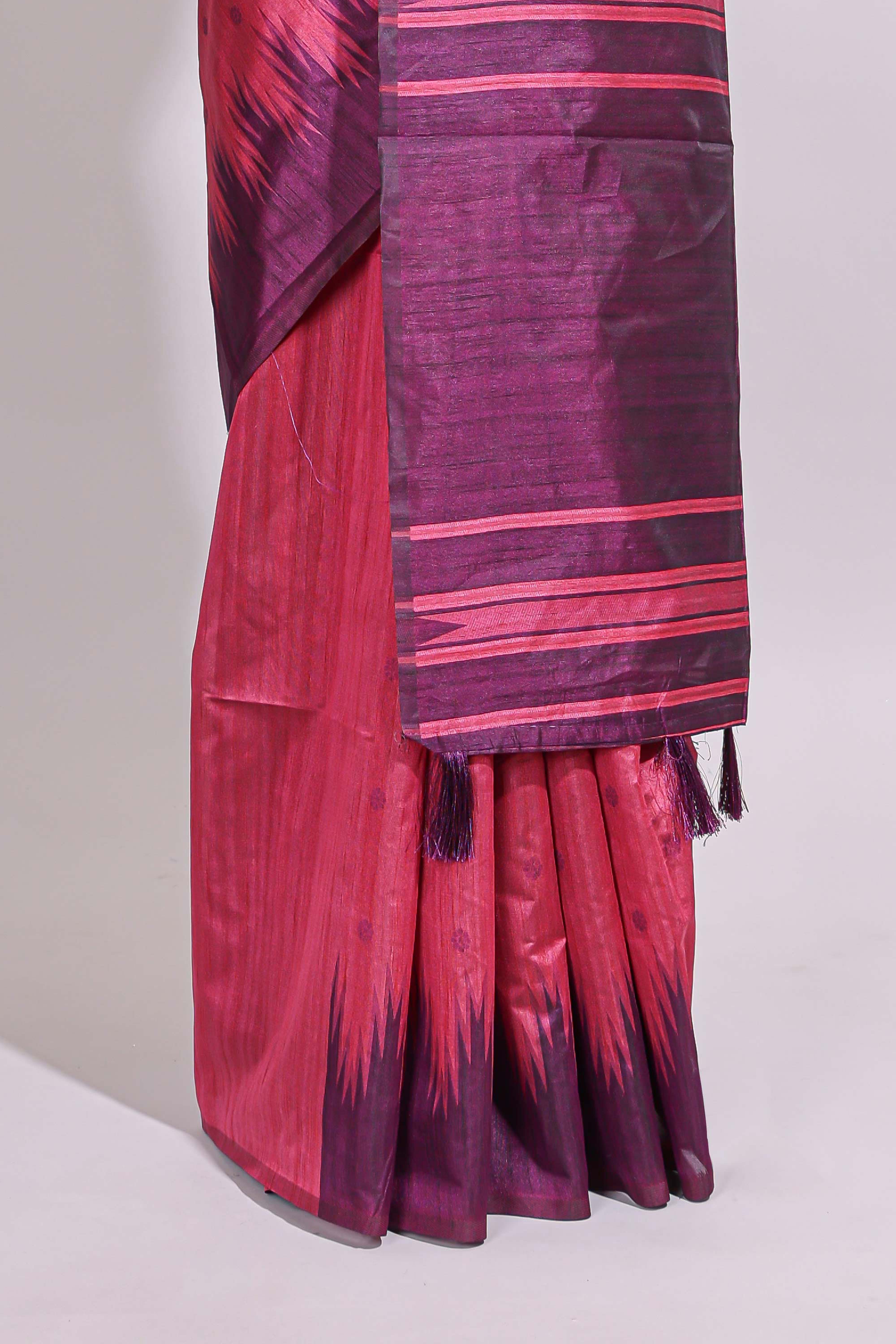 Deep pink textured floral motifs art tussar saree with contrast temple spire border and motifs blouse