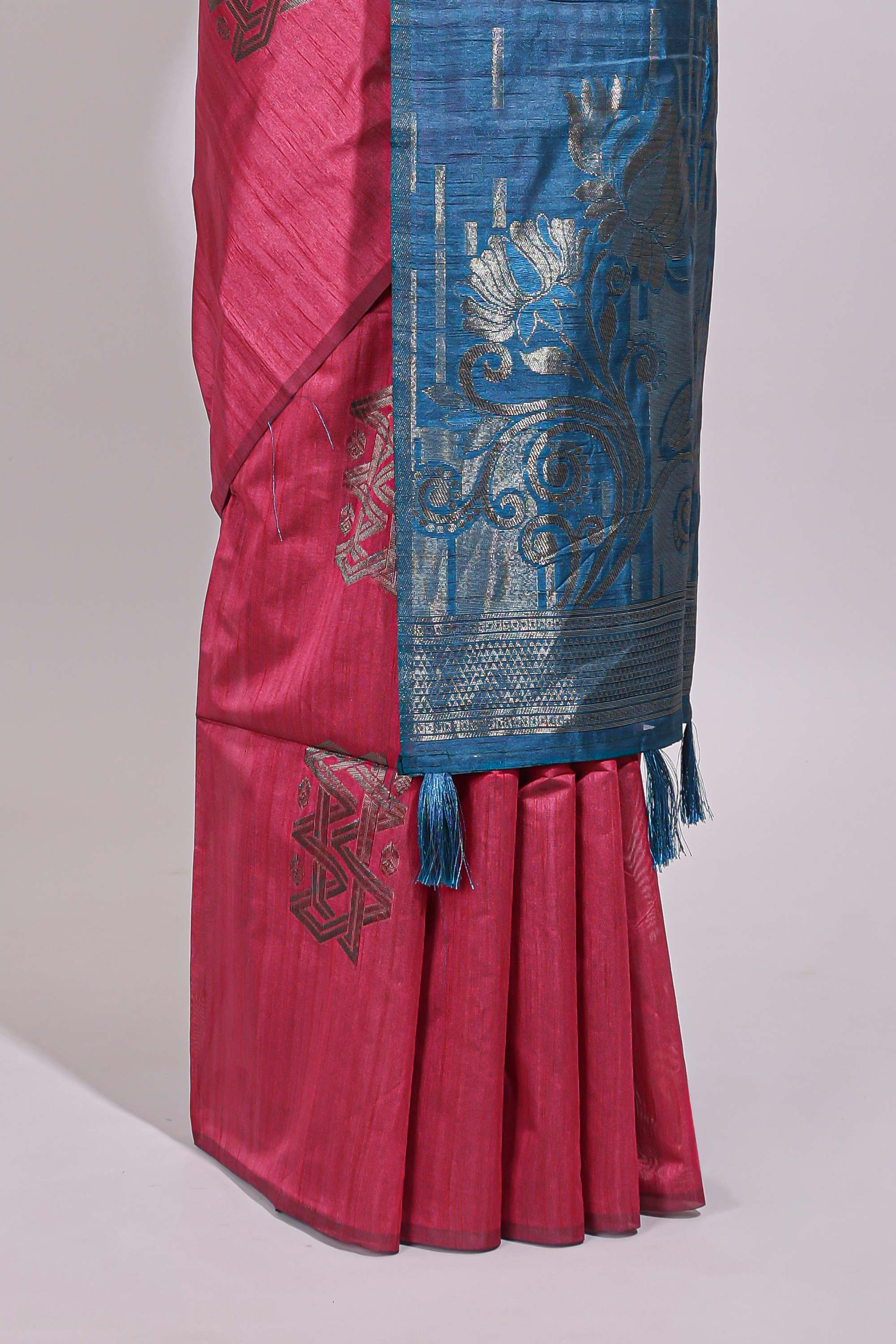 Borderless pink textured zari motifs art tussar saree with contrast floral design pallu and zari motifs blouse