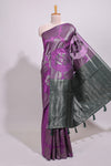 Borderless purple floral zari design art tussar saree with self floral design pallu and matching zari motifs blouse