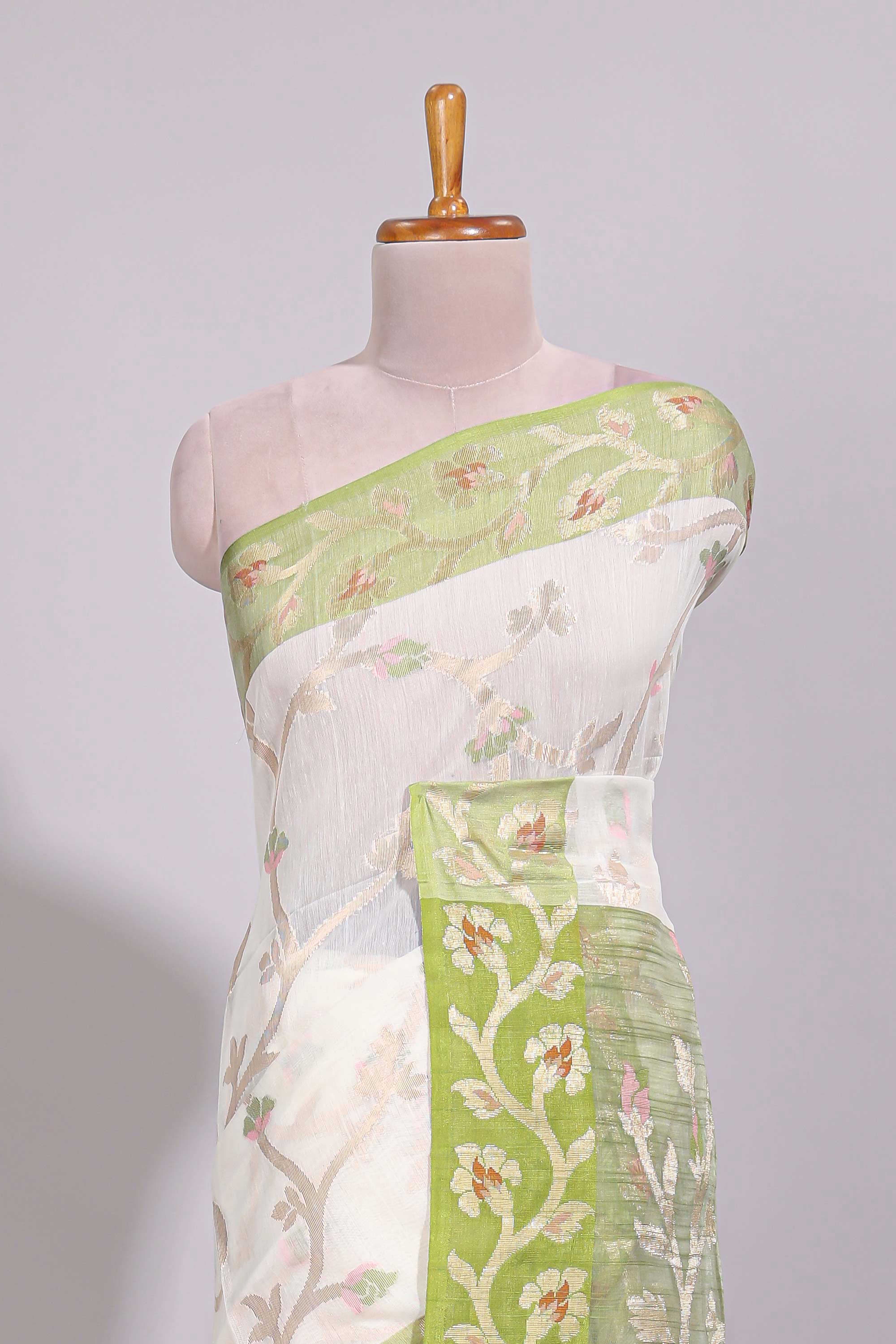White floral design art tussar saree with contrast border and floral vine pallu