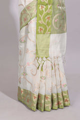 White floral design art tussar saree with contrast border and floral vine pallu