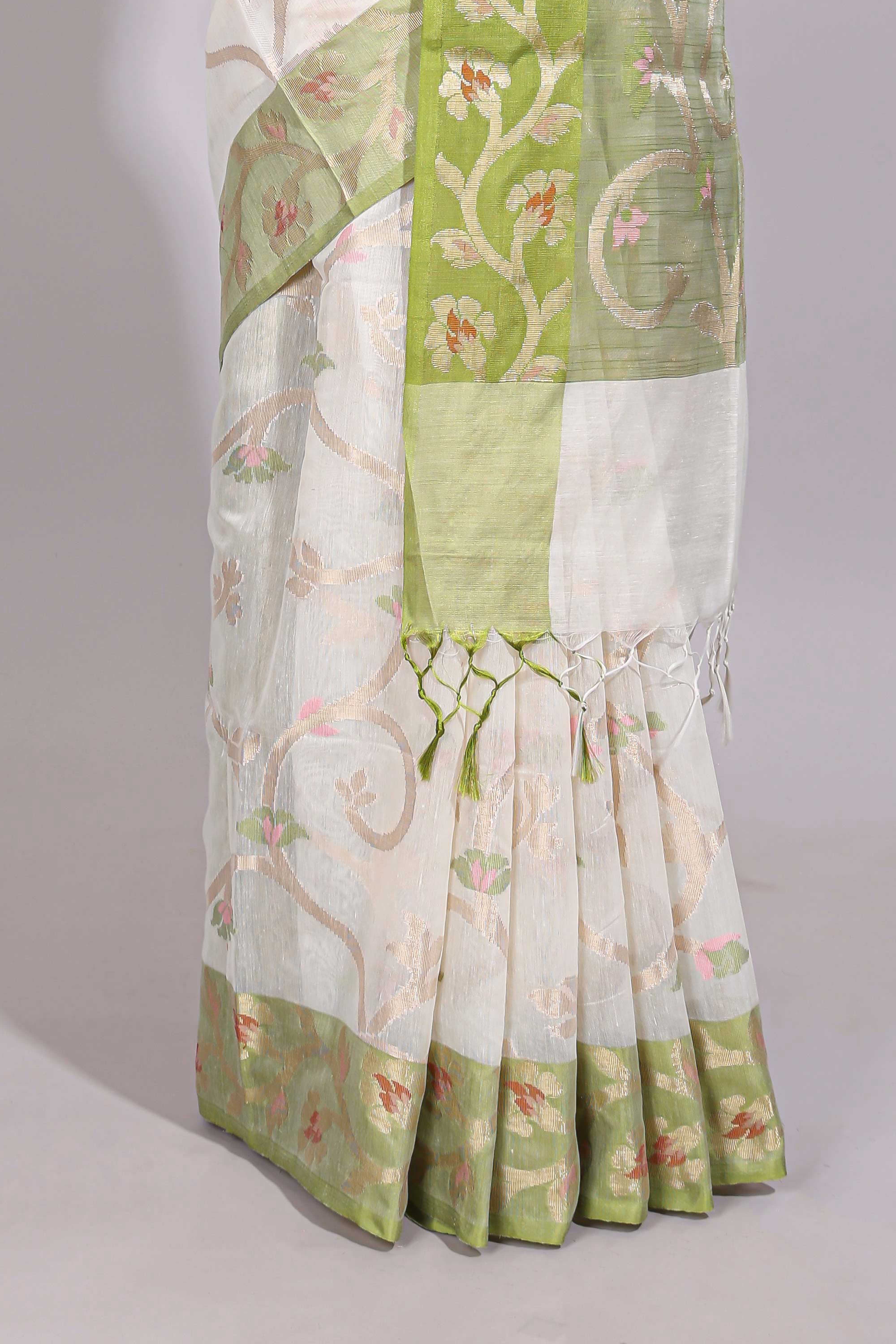 White floral design art tussar saree with contrast border and floral vine pallu