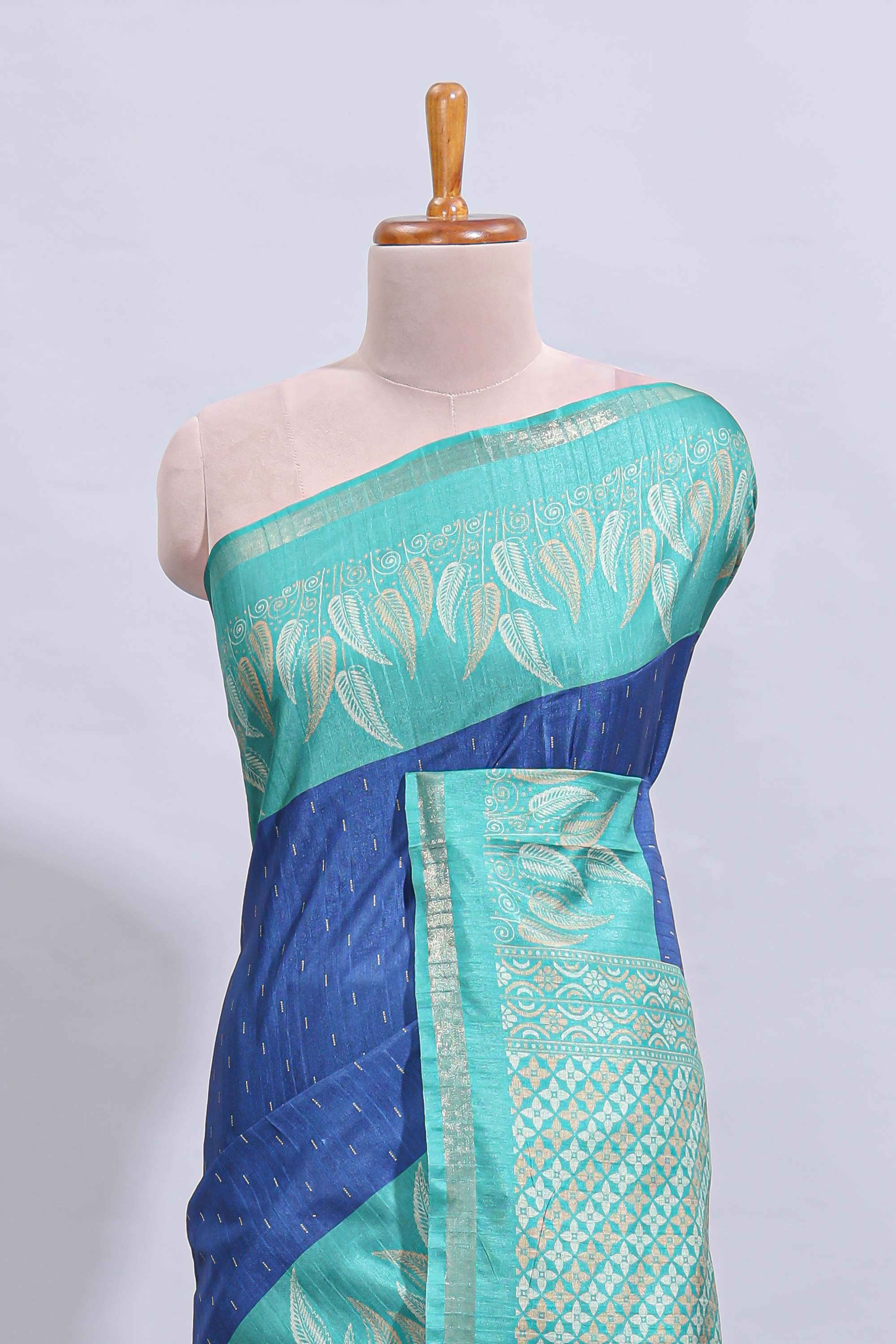 Blue geometric zari butta art tussar saree with contrast zari border and striped blouse