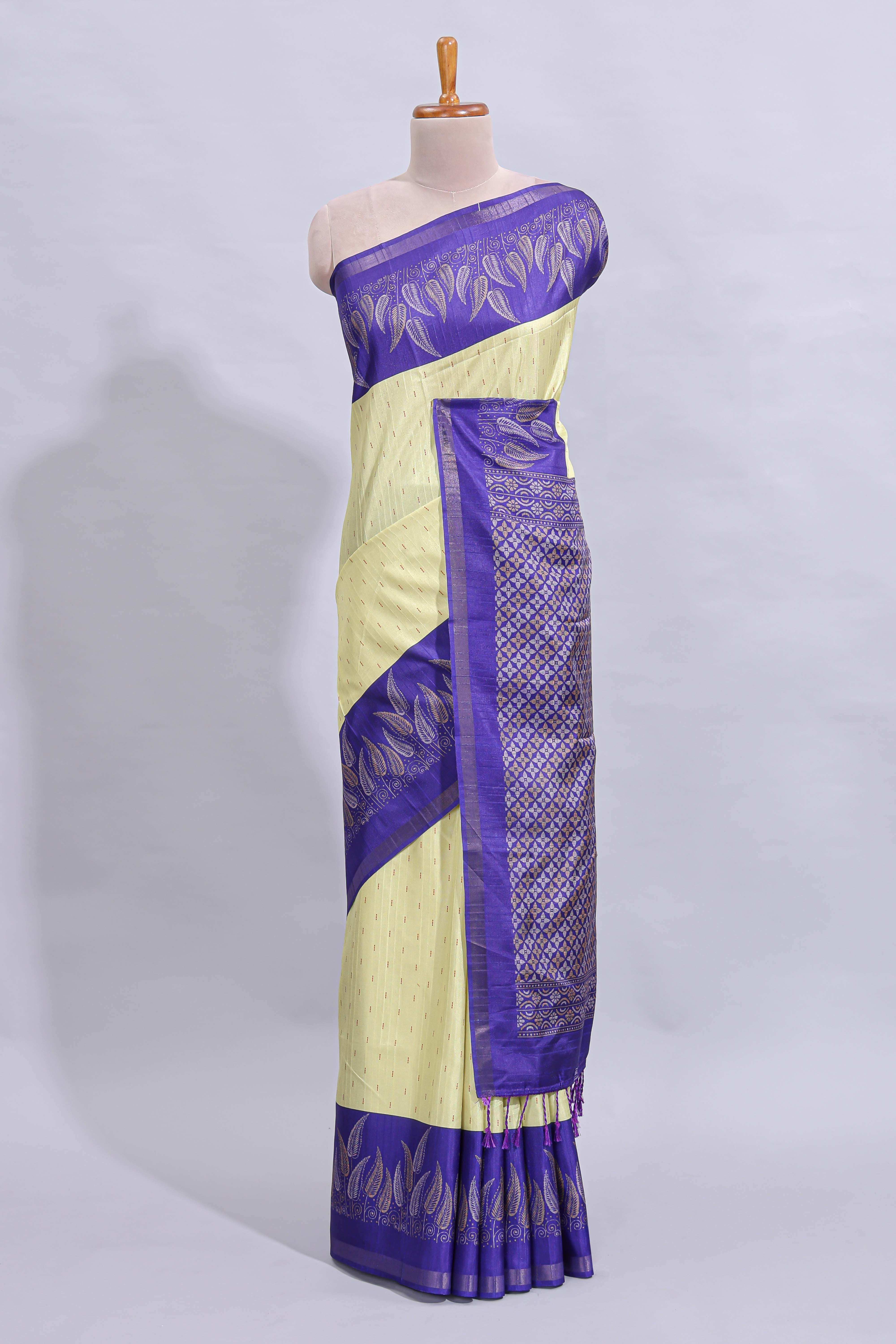 Pale yellow geometric zari butta art tussar saree with contrast zari border and striped blouse