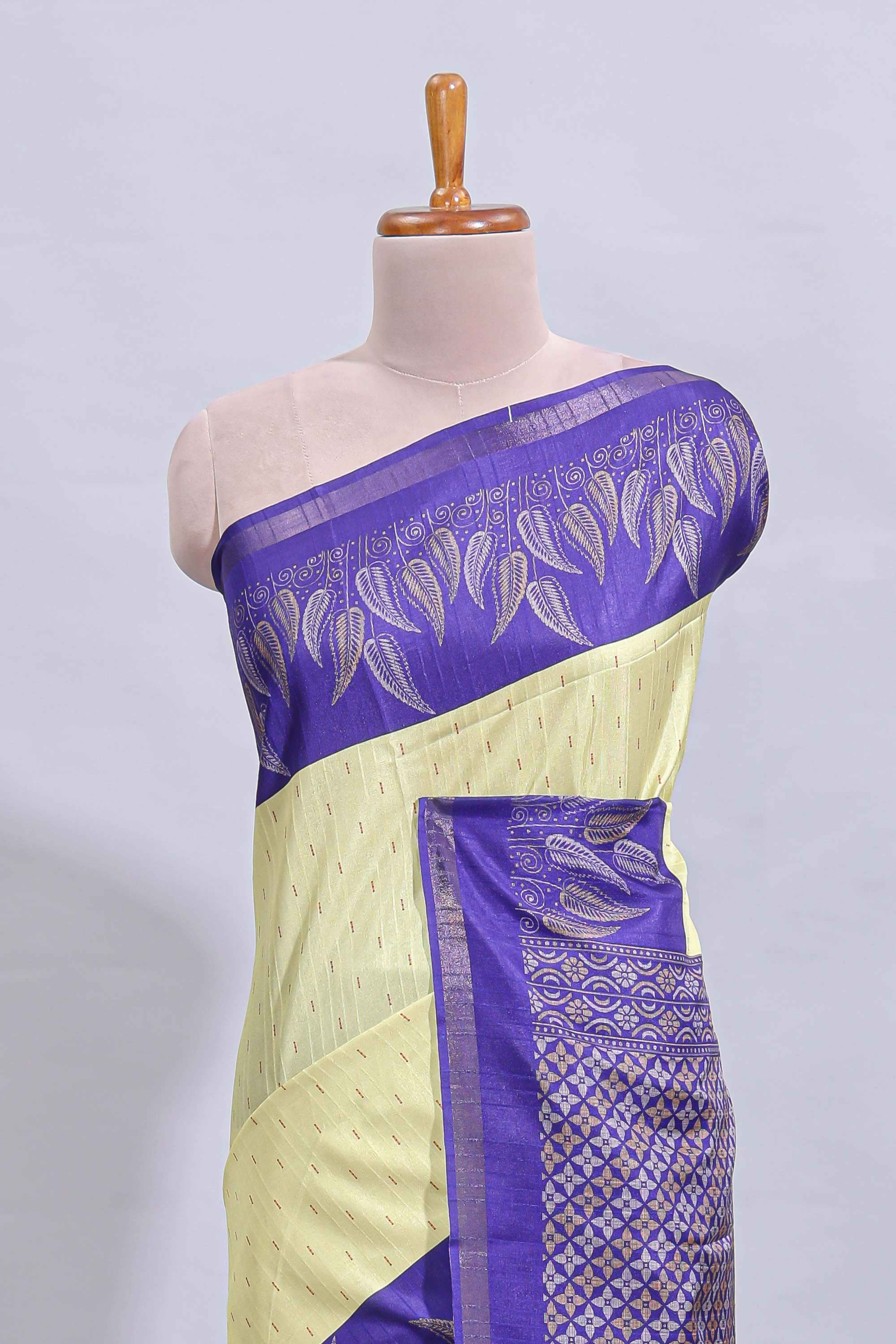 Pale yellow geometric zari butta art tussar saree with contrast zari border and striped blouse