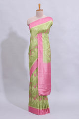 Green geometric design butta art tussar saree with contrast border and plain blouse
