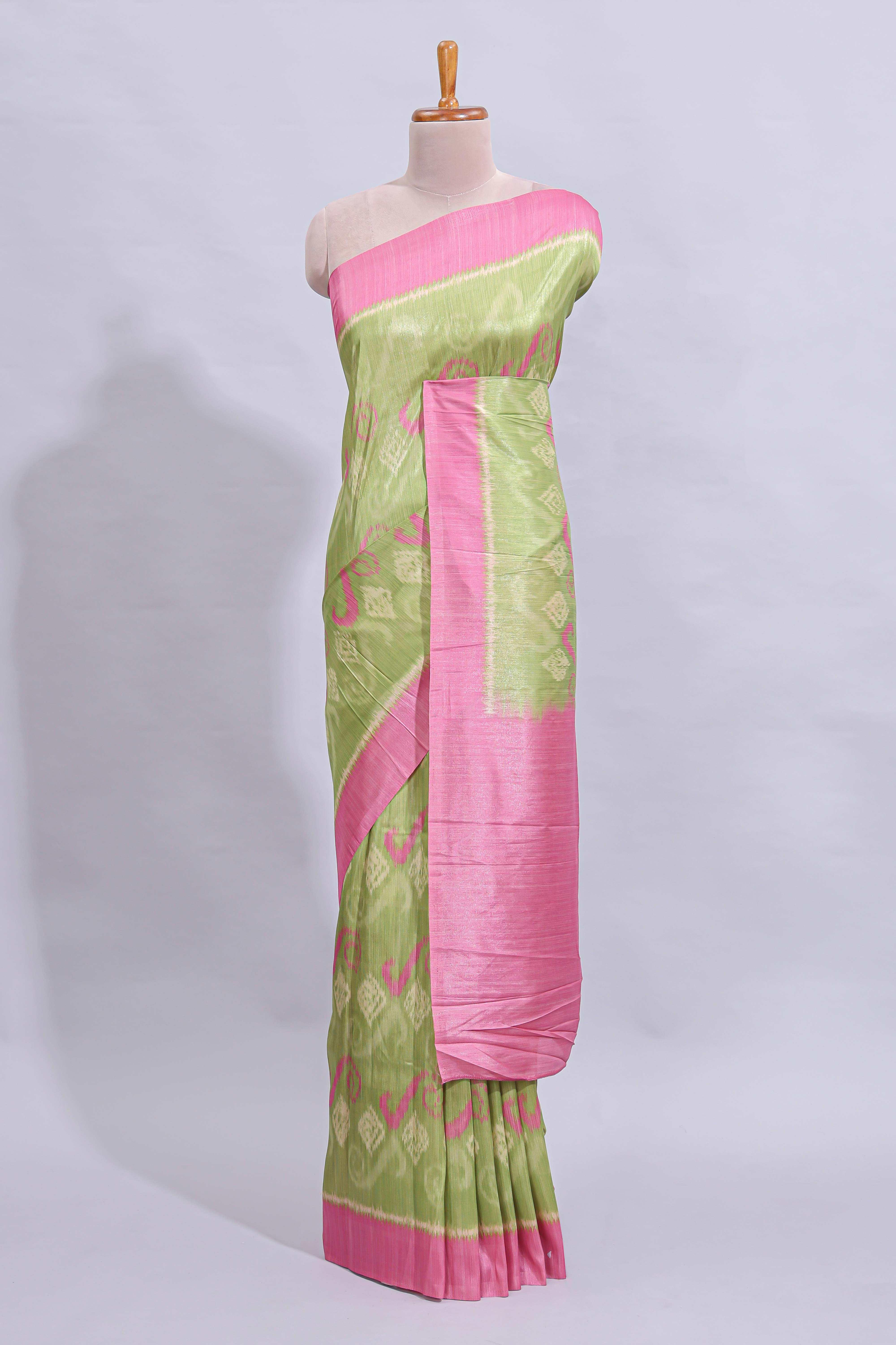 Green geometric design butta art tussar saree with contrast border and plain blouse