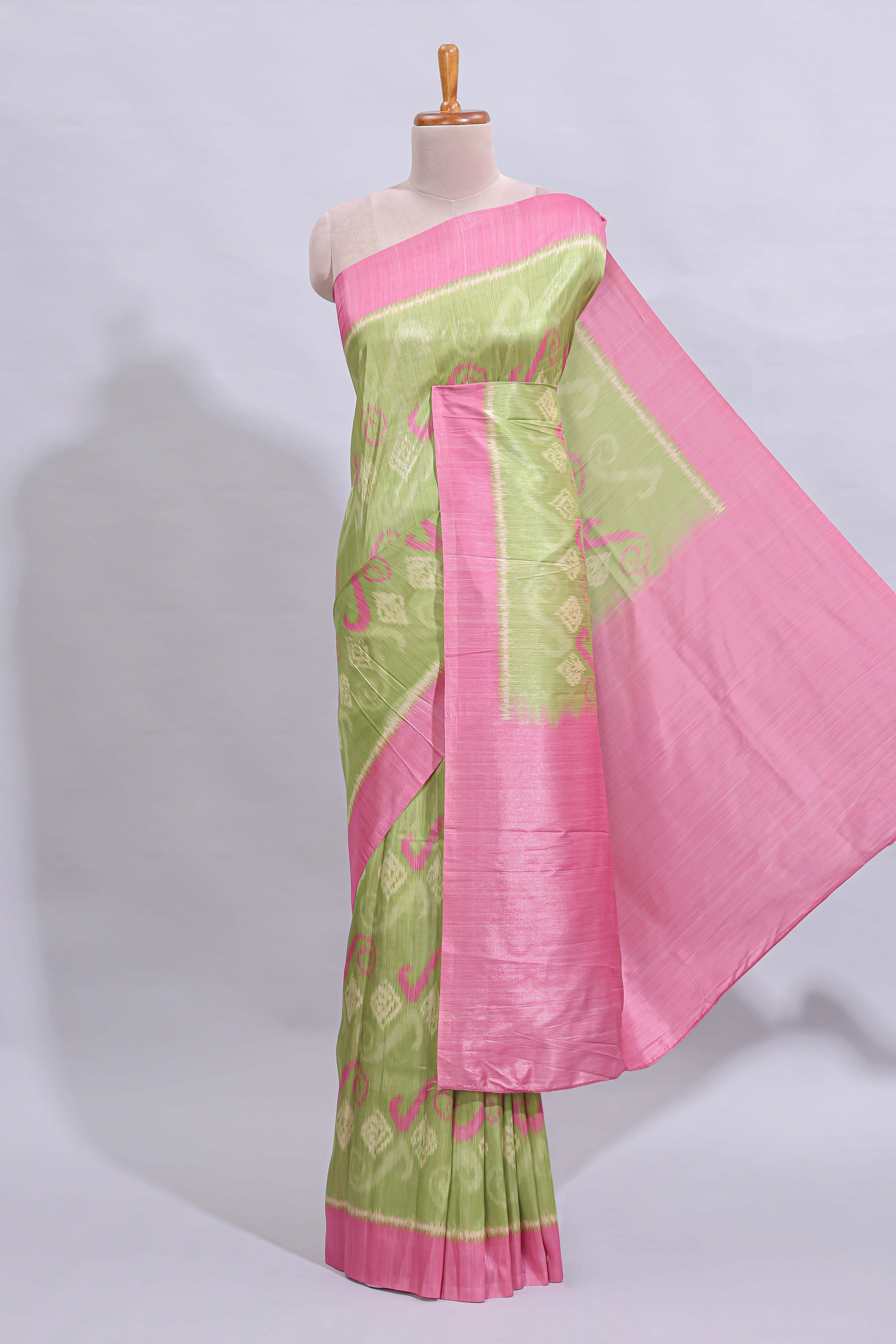 Green geometric design butta art tussar saree with contrast border and plain blouse