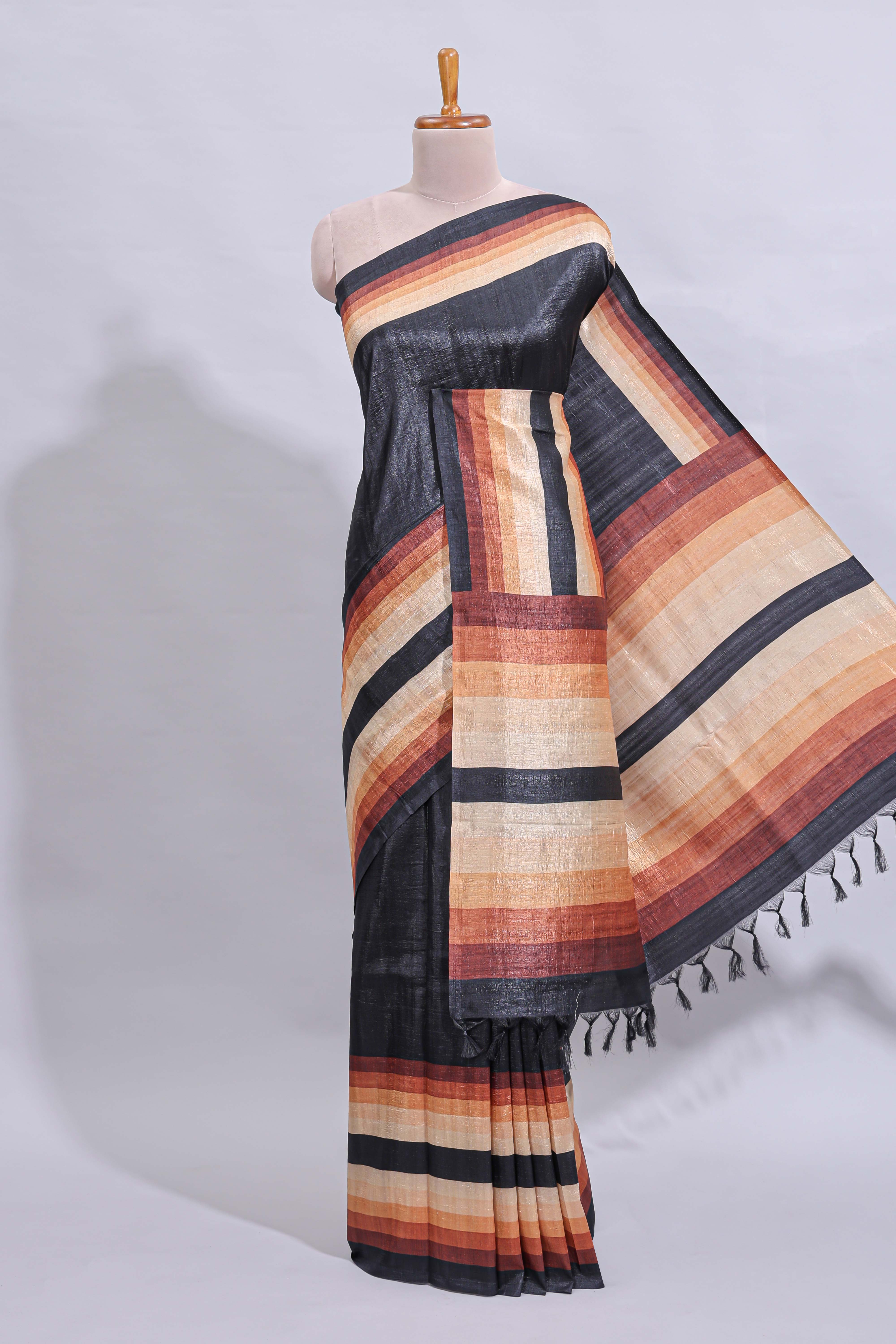 Black textured plain art tussar saree with contrast border and matching striped blouse