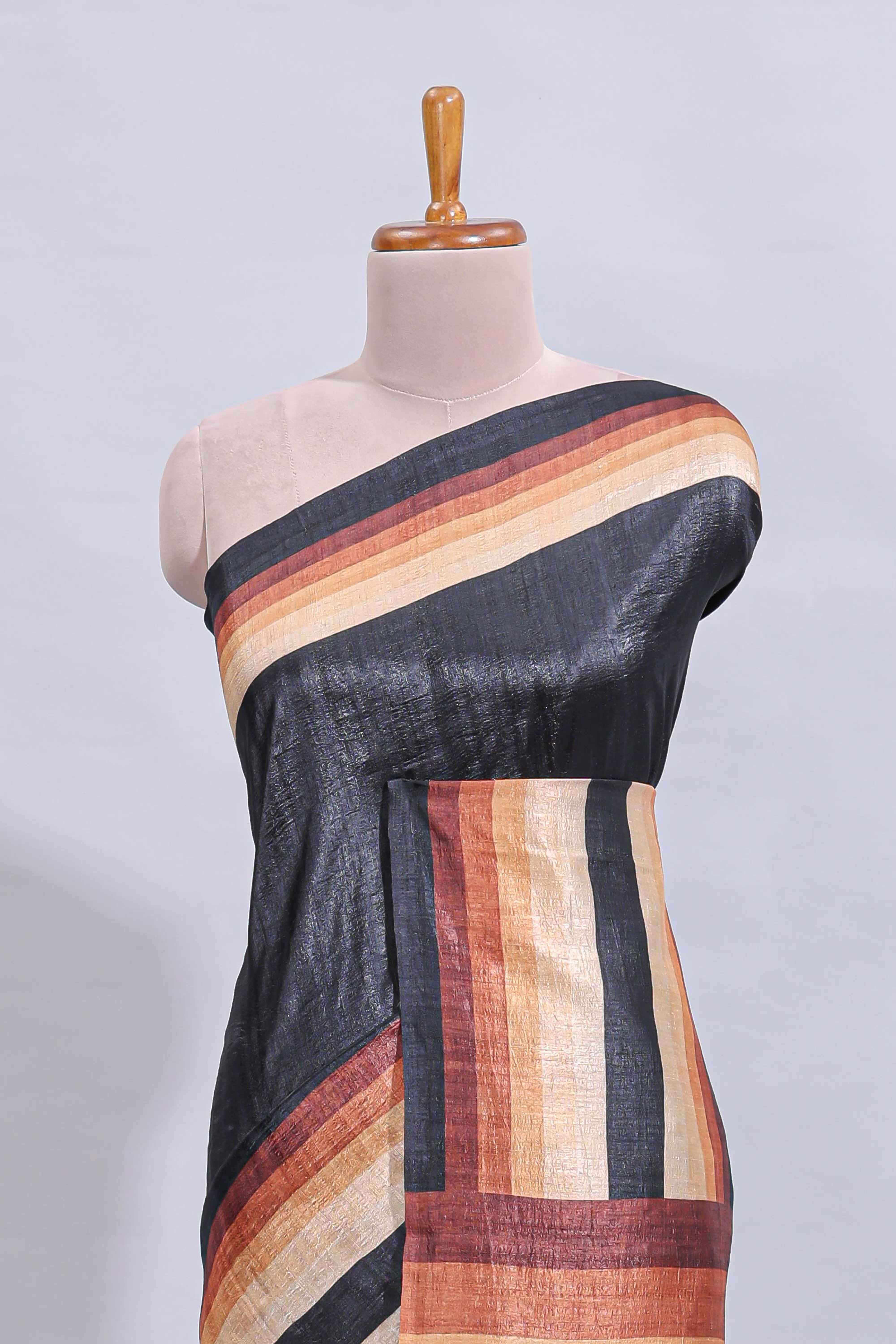 Black textured plain art tussar saree with contrast border and matching striped blouse