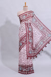 Pale pink floral design art tussar saree with contrast border and matching motifs blouse