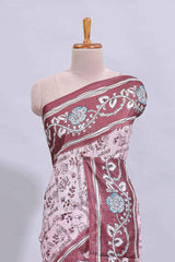 Pale pink floral design art tussar saree with contrast border and matching motifs blouse