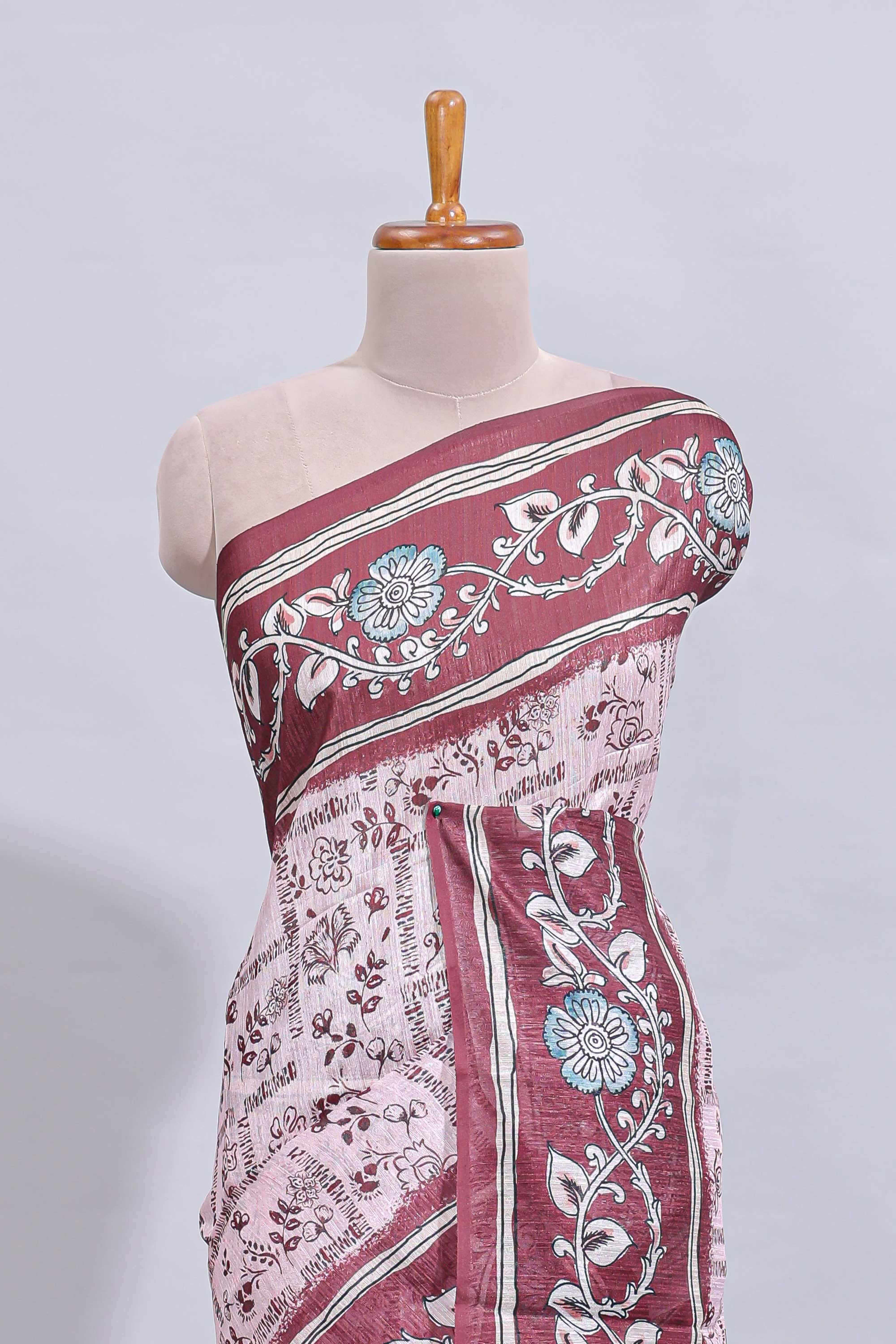 Pale pink floral design art tussar saree with contrast border and matching motifs blouse