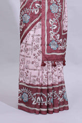 Pale pink floral design art tussar saree with contrast border and matching motifs blouse