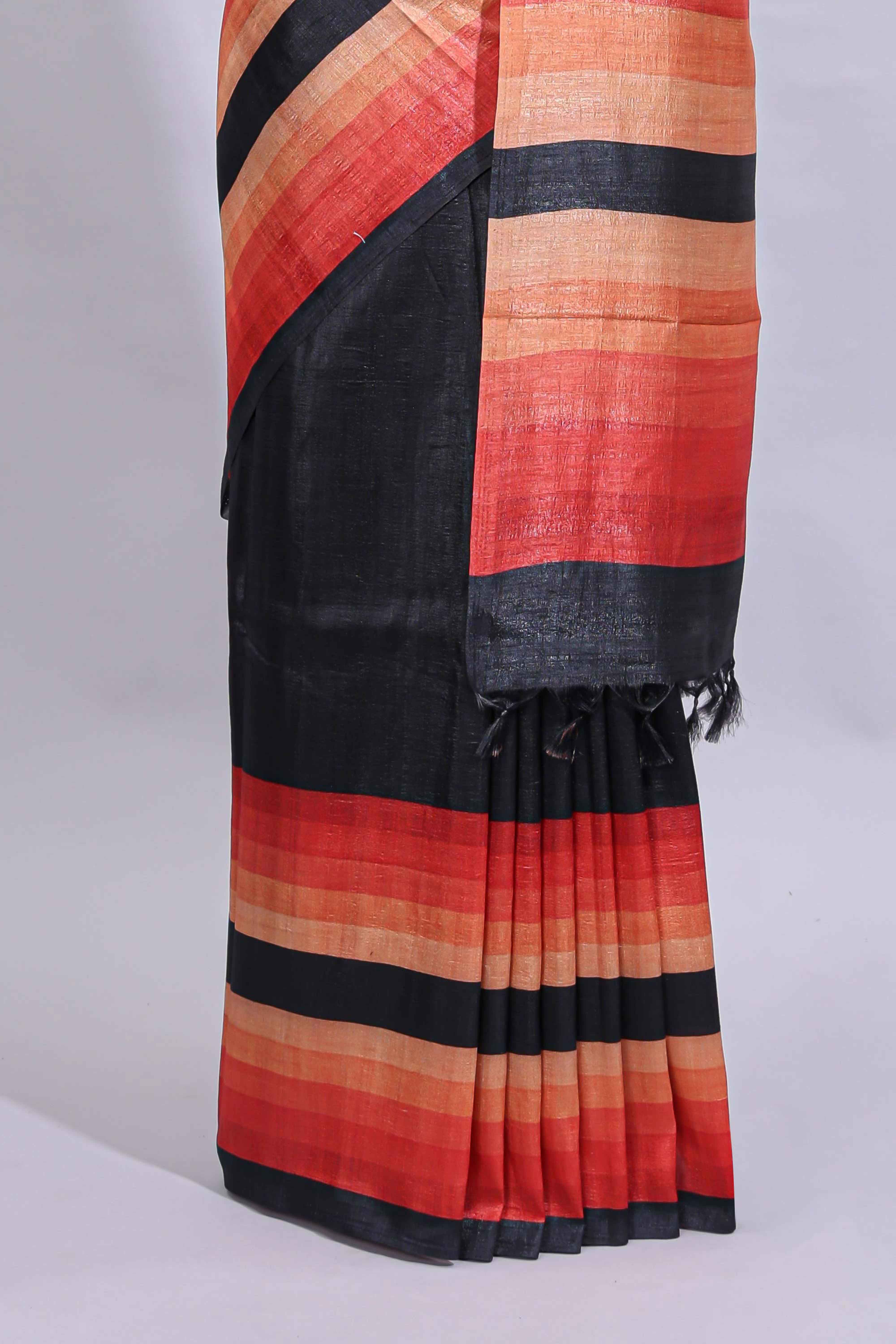 Black textured plain art tussar saree with contrast orange border and matching striped blouse