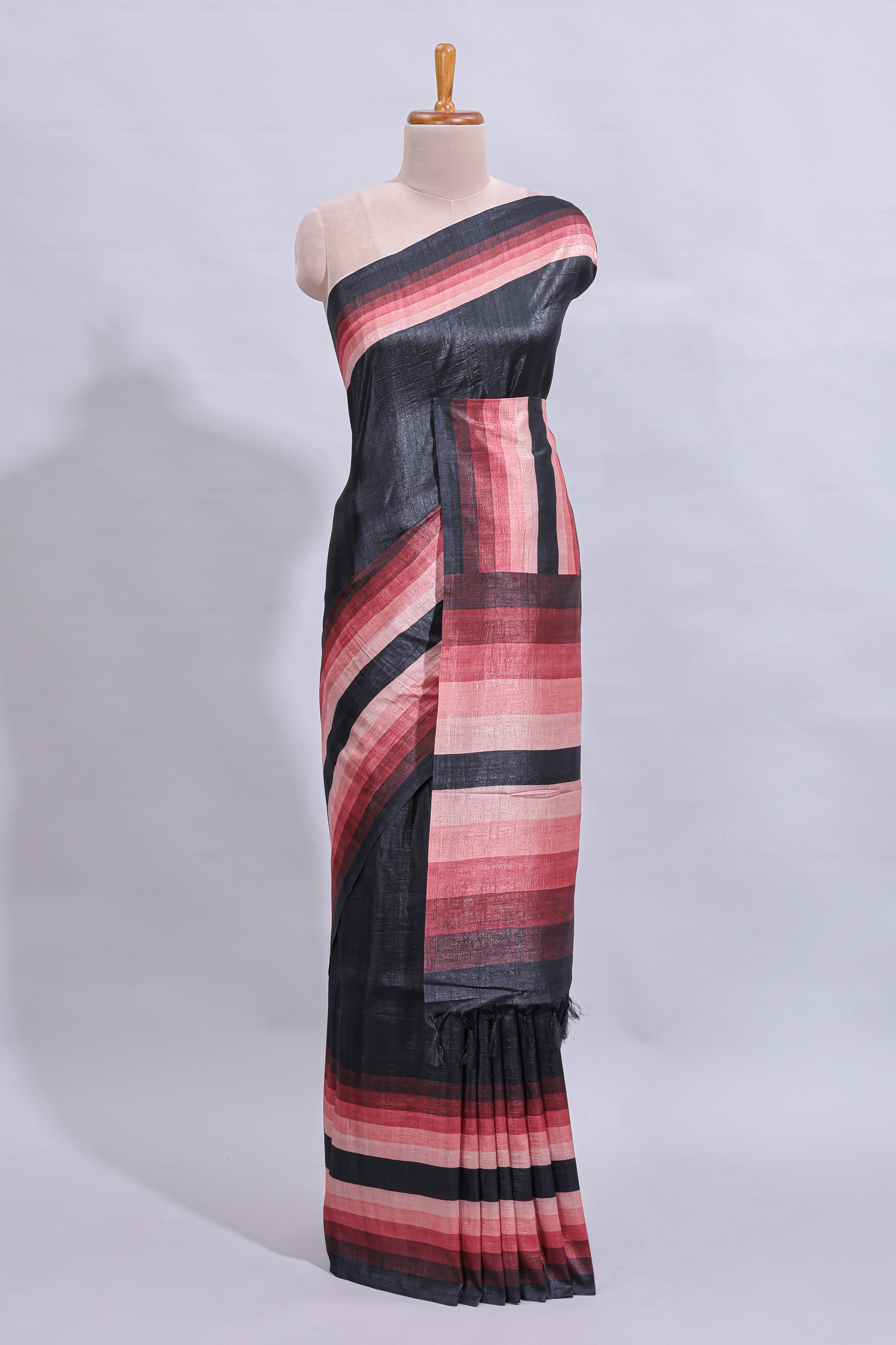 Black textured plain art tussar saree with contrast pink border and matching striped blouse