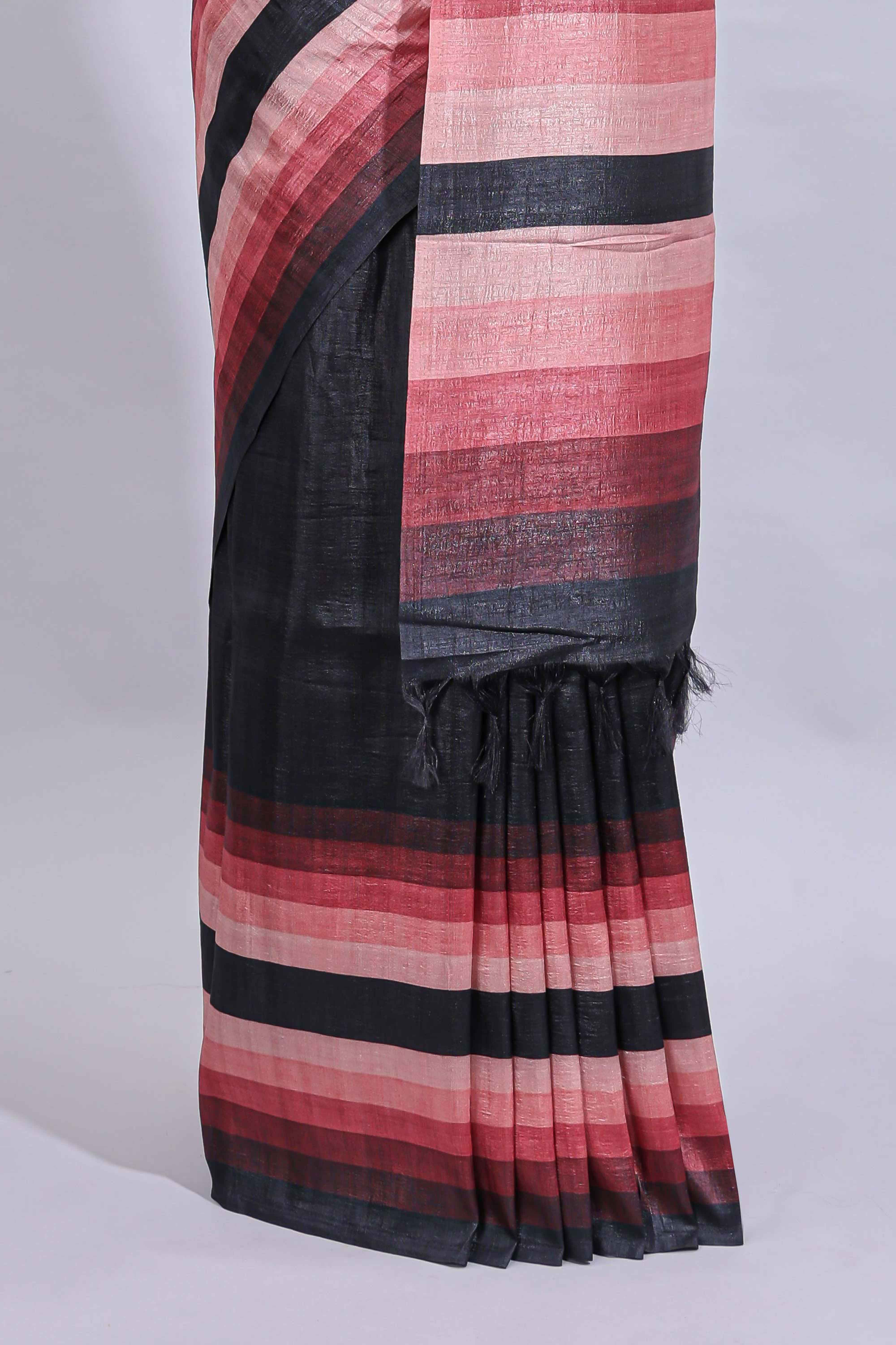 Black textured plain art tussar saree with contrast pink border and matching striped blouse