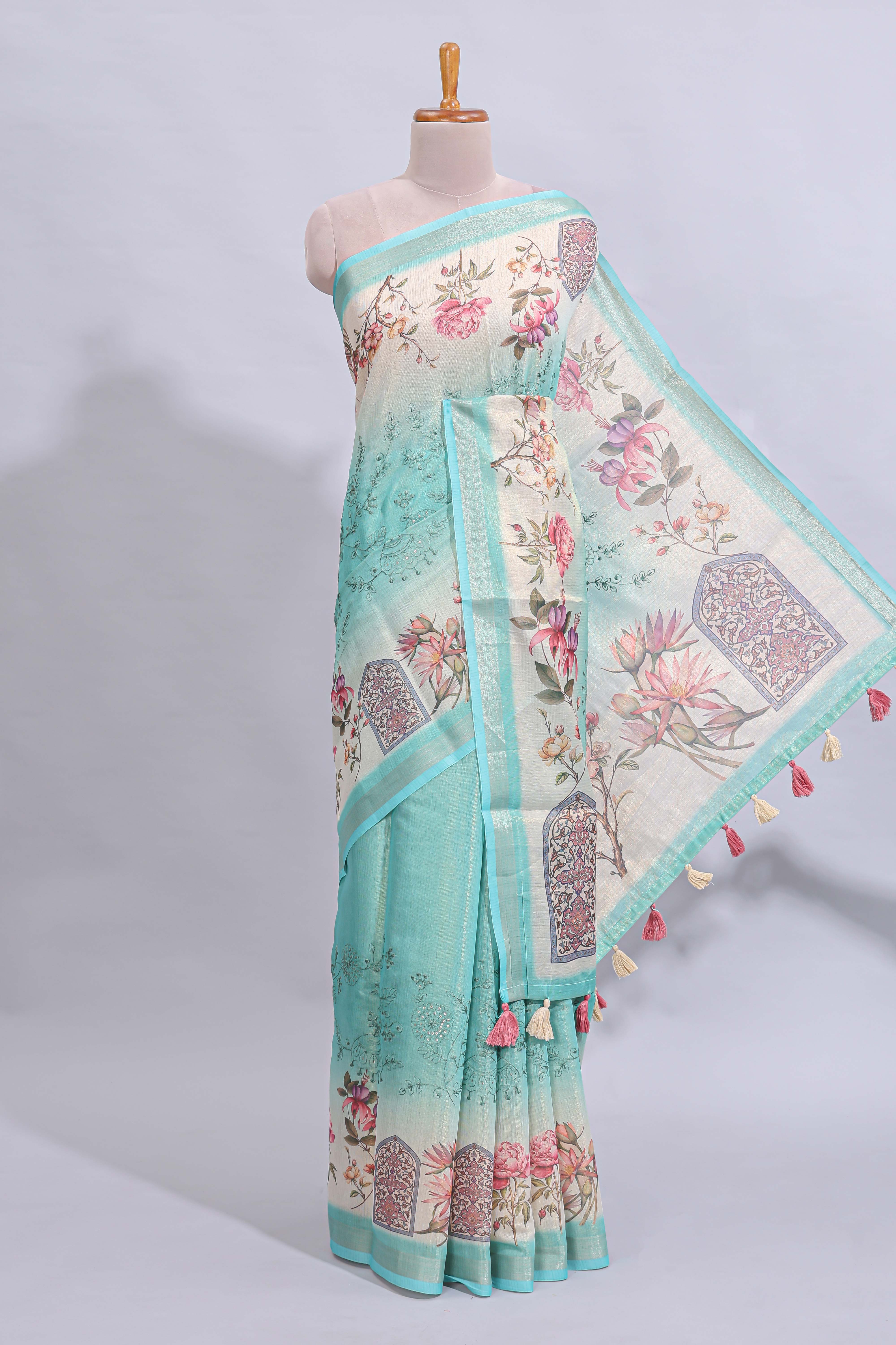 Blue floral design art tussar saree with self zari border and matching printed blouse