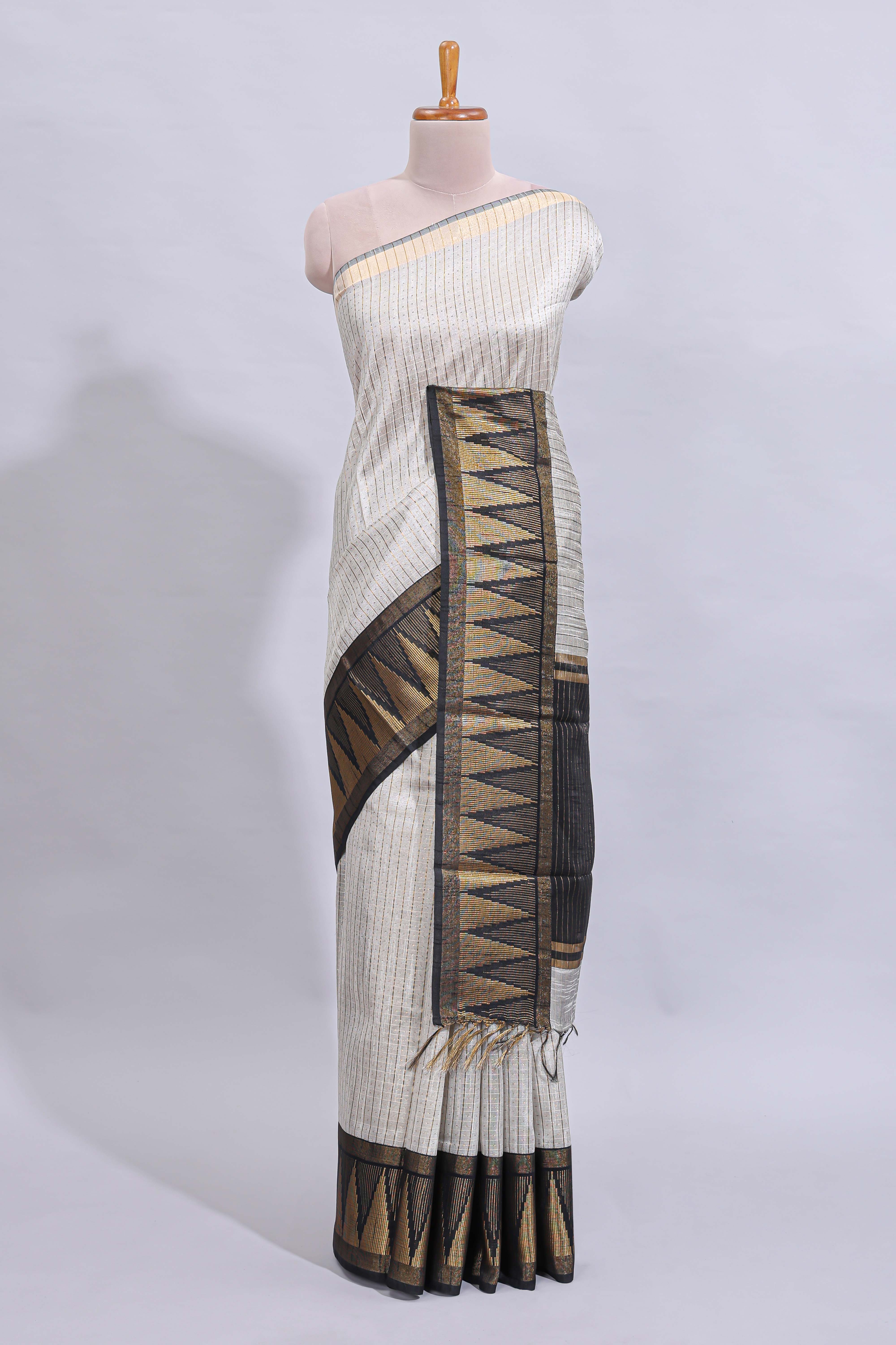 Light grey checked art tussar saree with contrast temple zari border and striped blouse