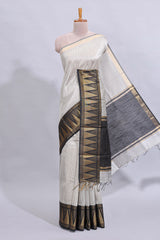Light grey checked art tussar saree with contrast temple zari border and striped blouse