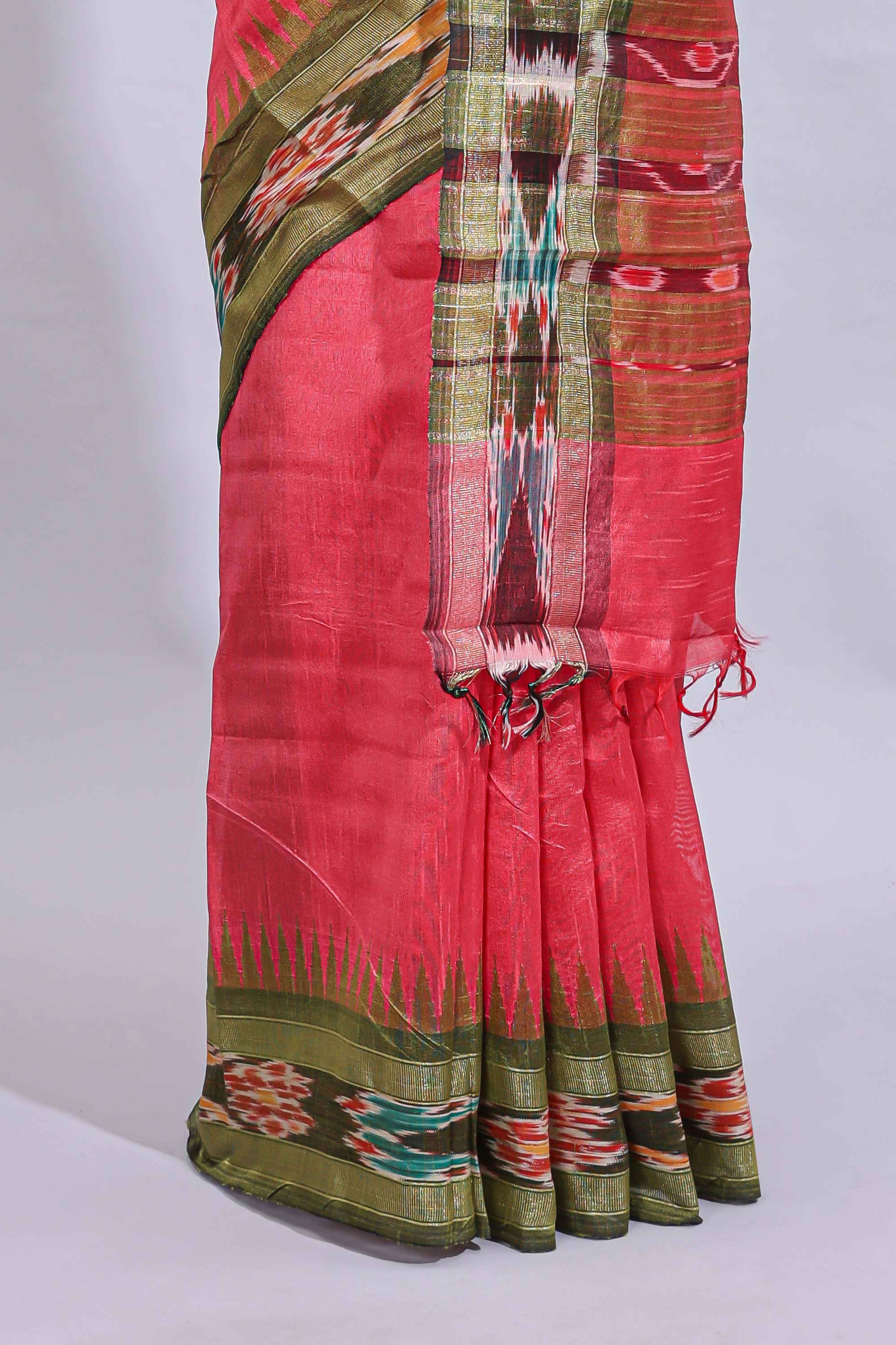Pink plain art tussar saree with contrast ikkat style border and floral design striped pallu