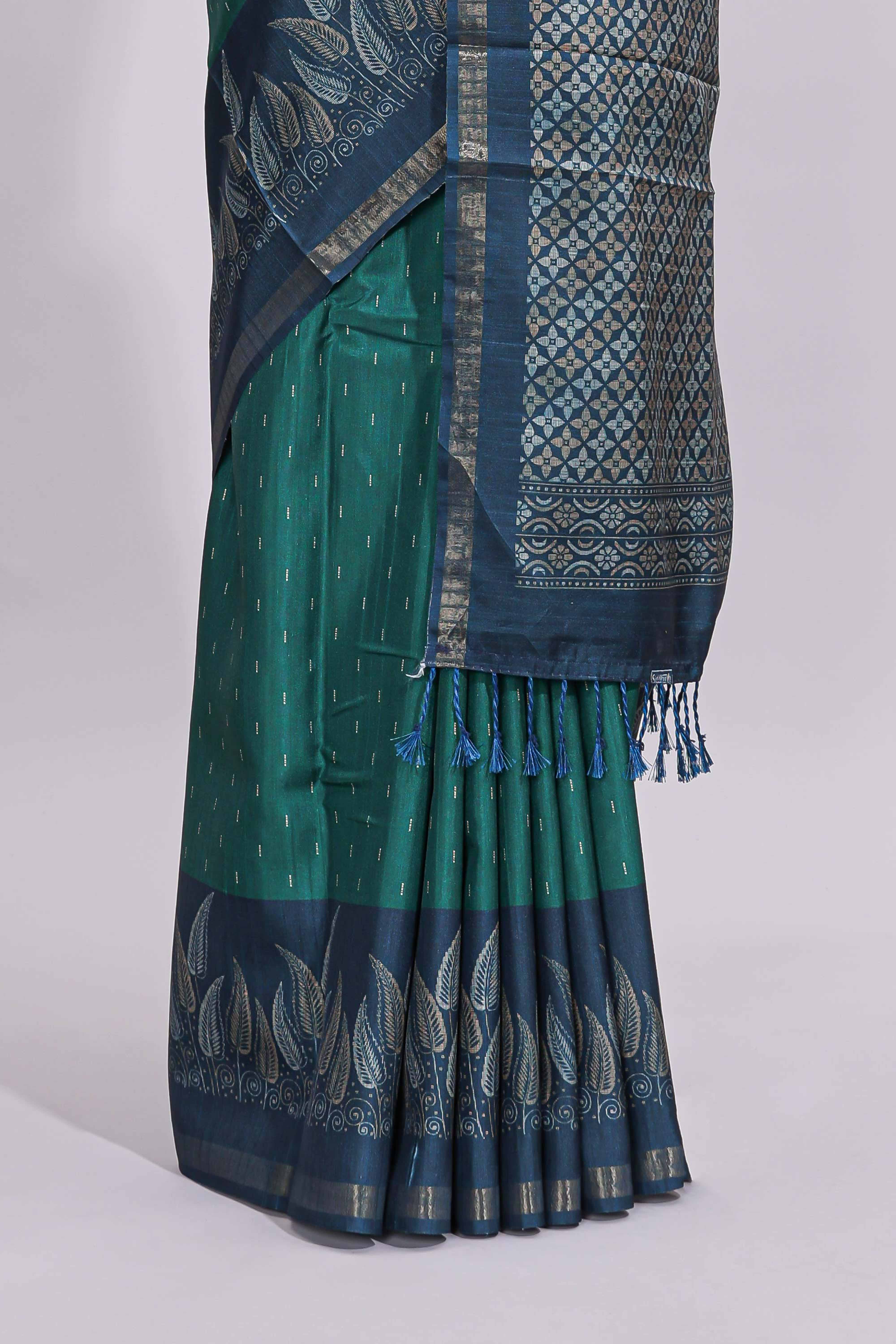 Green motifs art tussar saree with contrast leaf design border and striped blouse