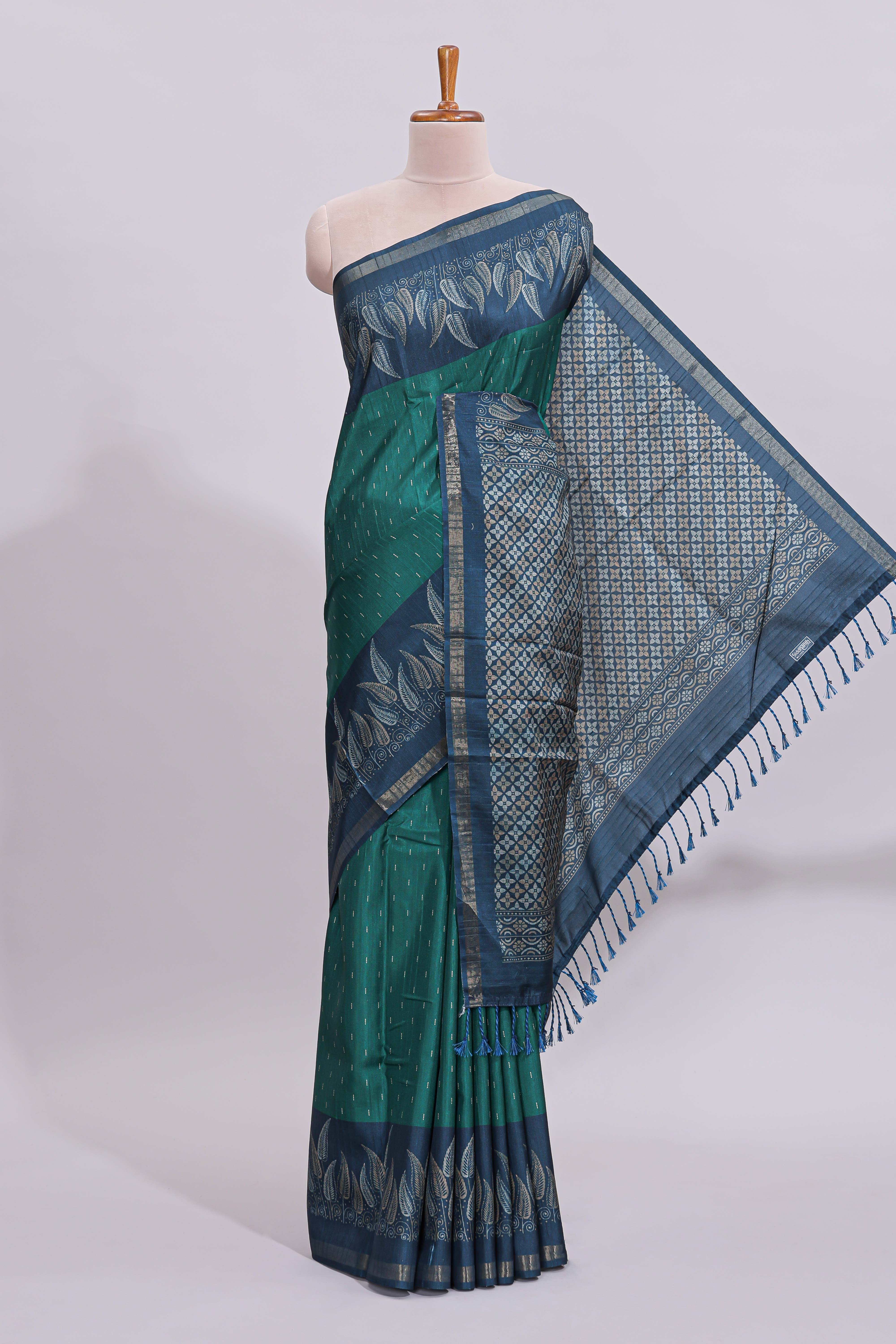 Green motifs art tussar saree with contrast leaf design border and striped blouse
