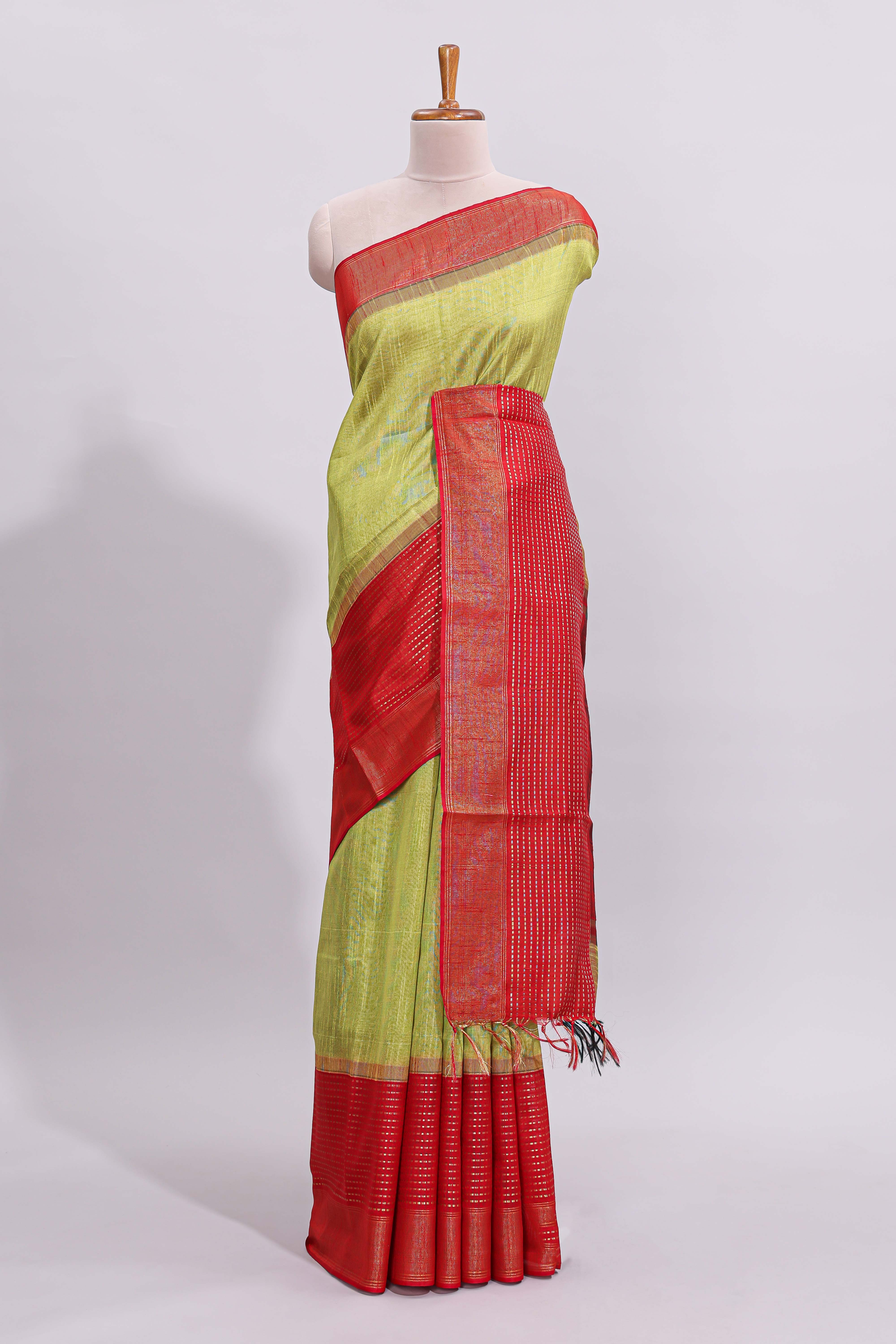 Green plain design art tussar saree with contrast striped border and blouse