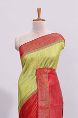 Green plain design art tussar saree with contrast striped border and blouse
