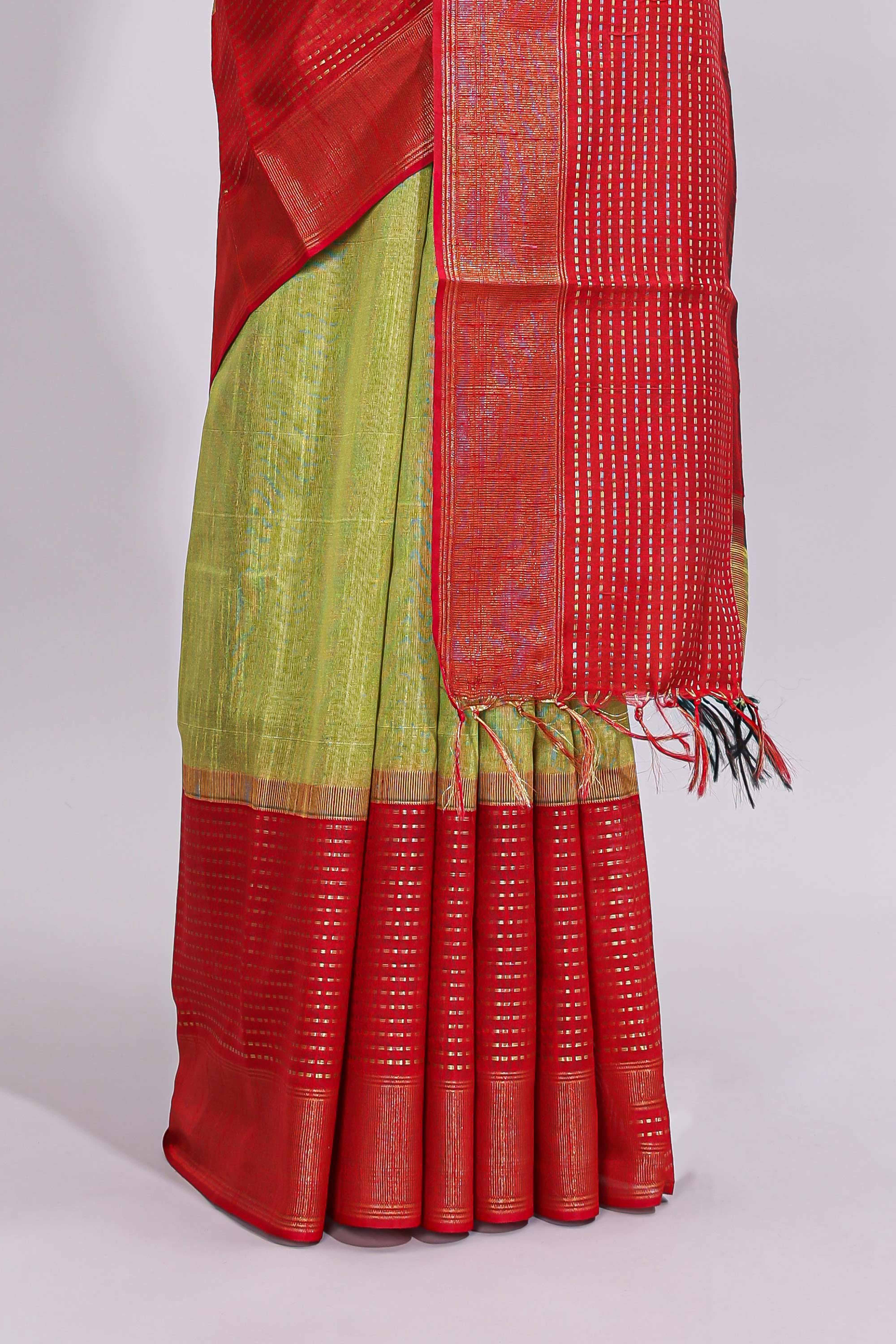Green plain design art tussar saree with contrast striped border and blouse