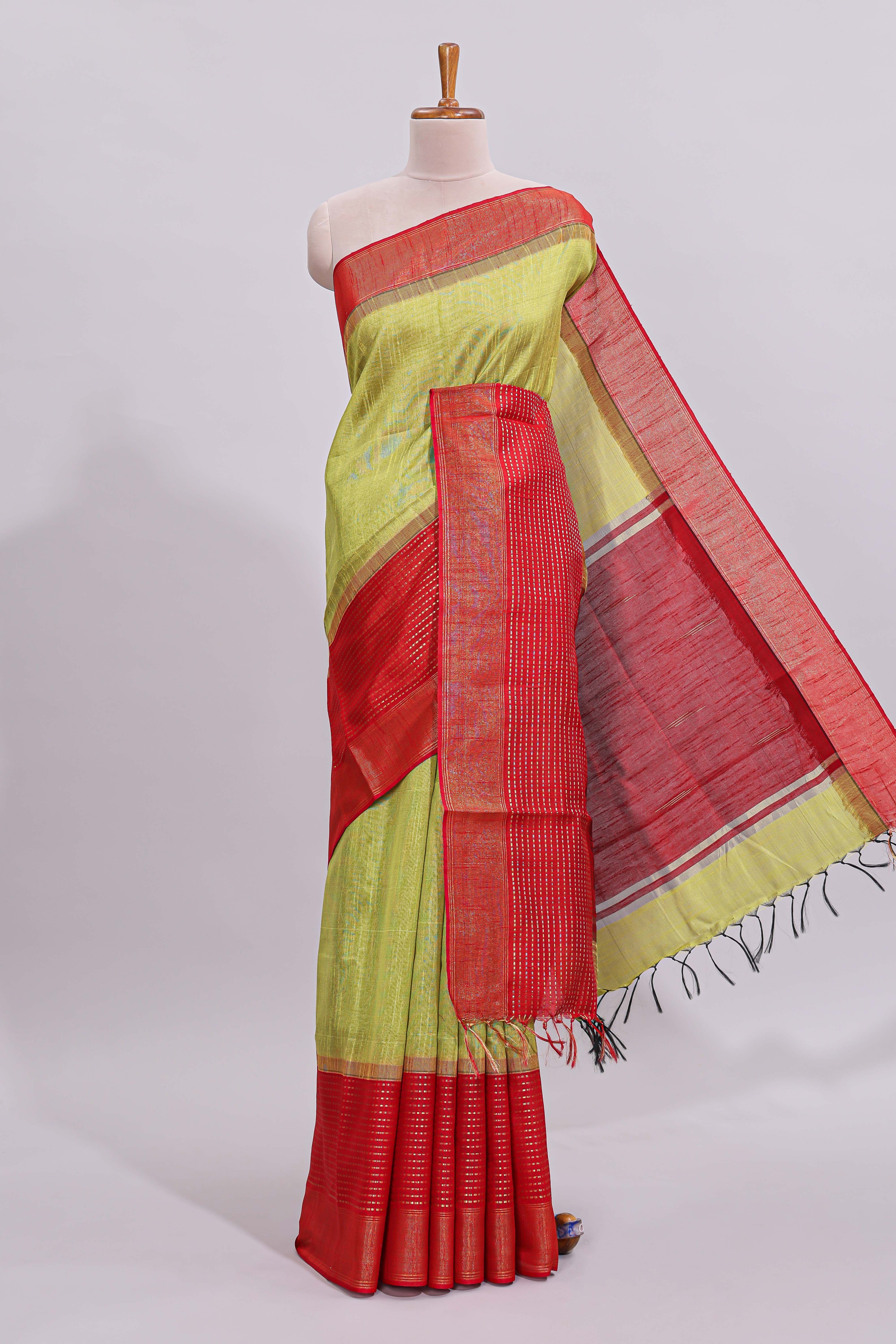 Green plain design art tussar saree with contrast striped border and blouse