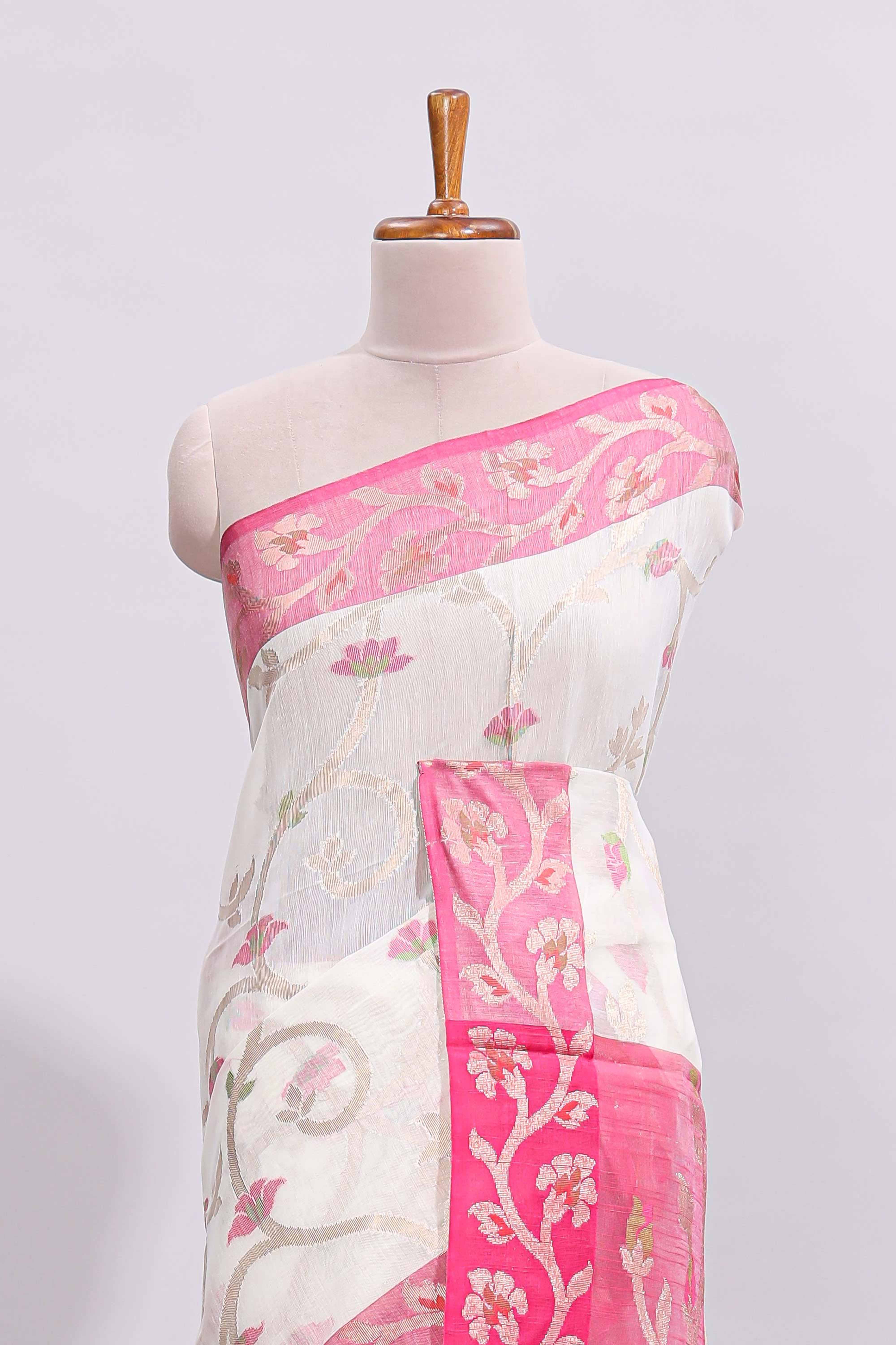 White floral design art tussar saree with contrast border and zari blouse