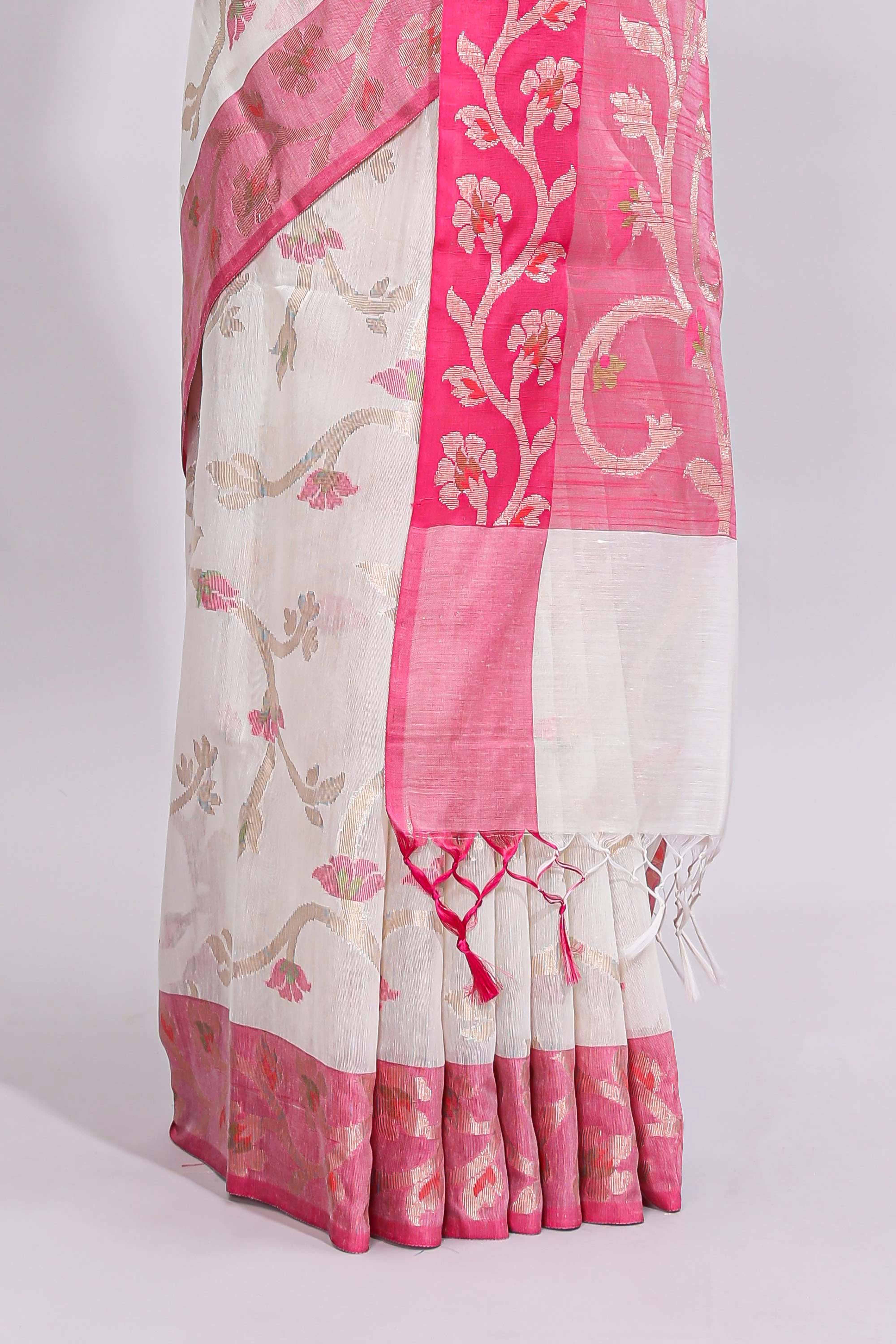 White floral design art tussar saree with contrast border and zari blouse