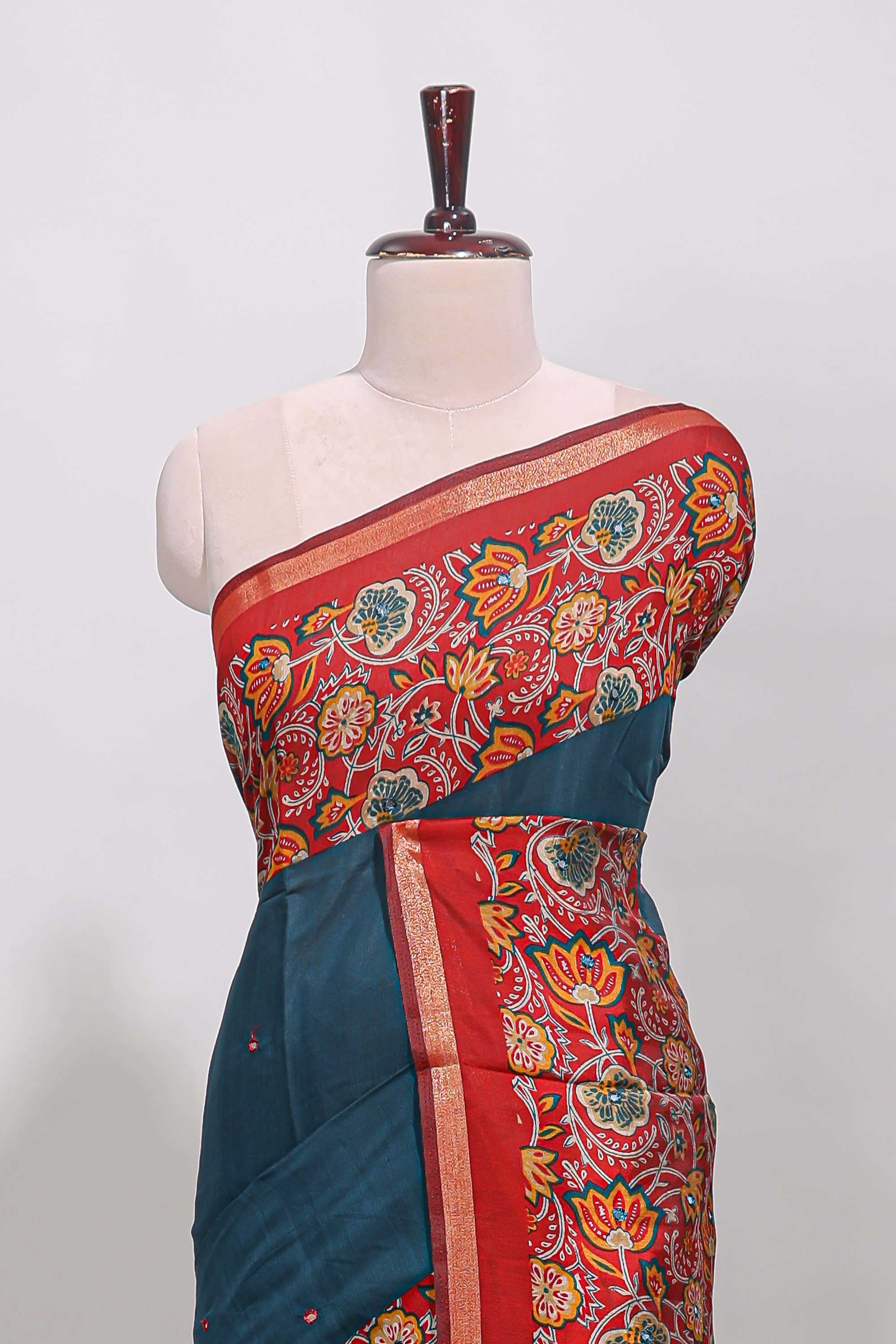 Blue embroidery mirror work viscose georgette saree with contrast floral vine zari border and printed blouse