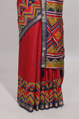 Red embroidery mirror work viscose georgette saree with contrast chevron design zari border and printed pallu
