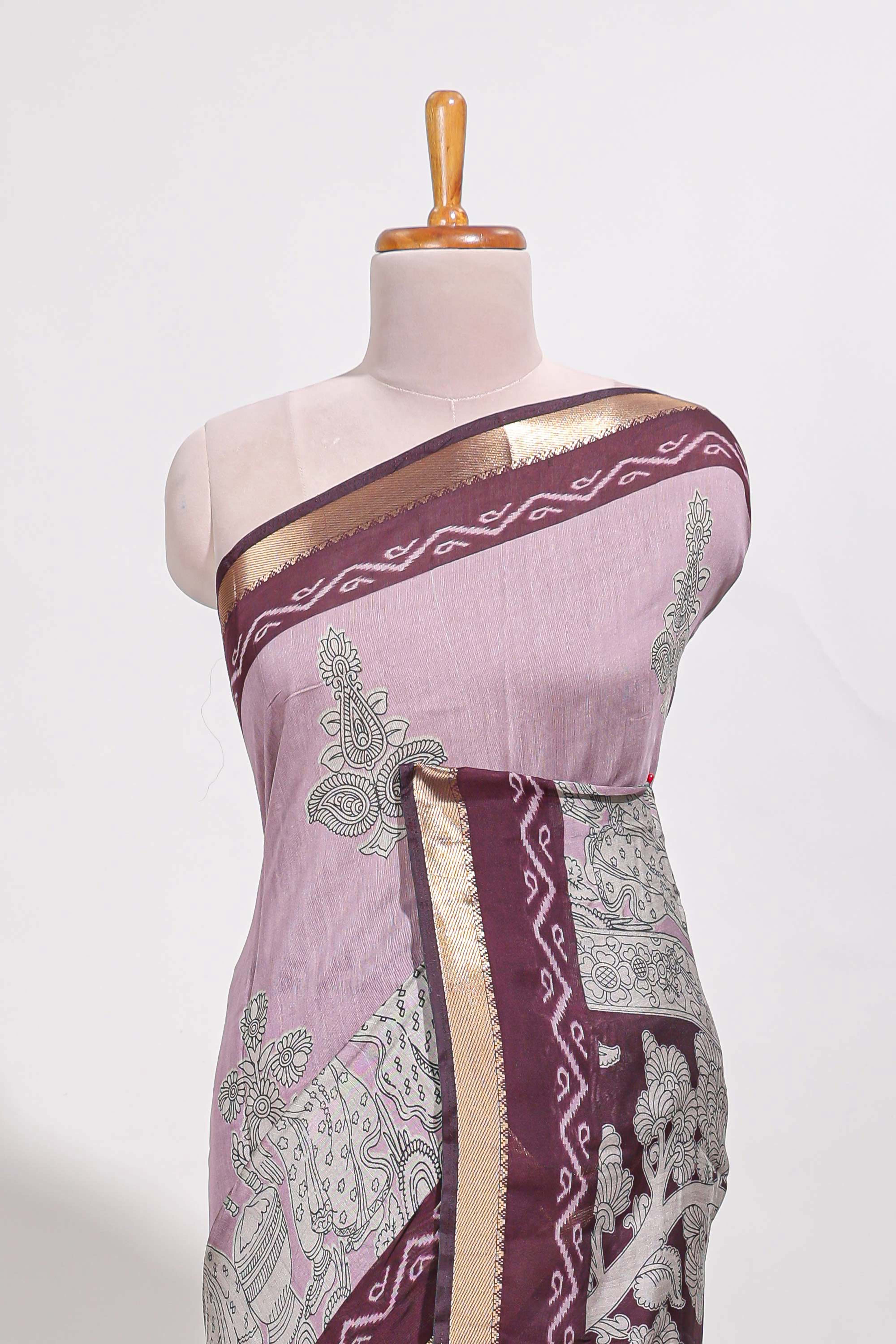 Lavender Mauve Viscose Georgette Saree All-over elegant ethnic detailing gold zari border and Statement pallu with artistic motifs with contrast printed blouse