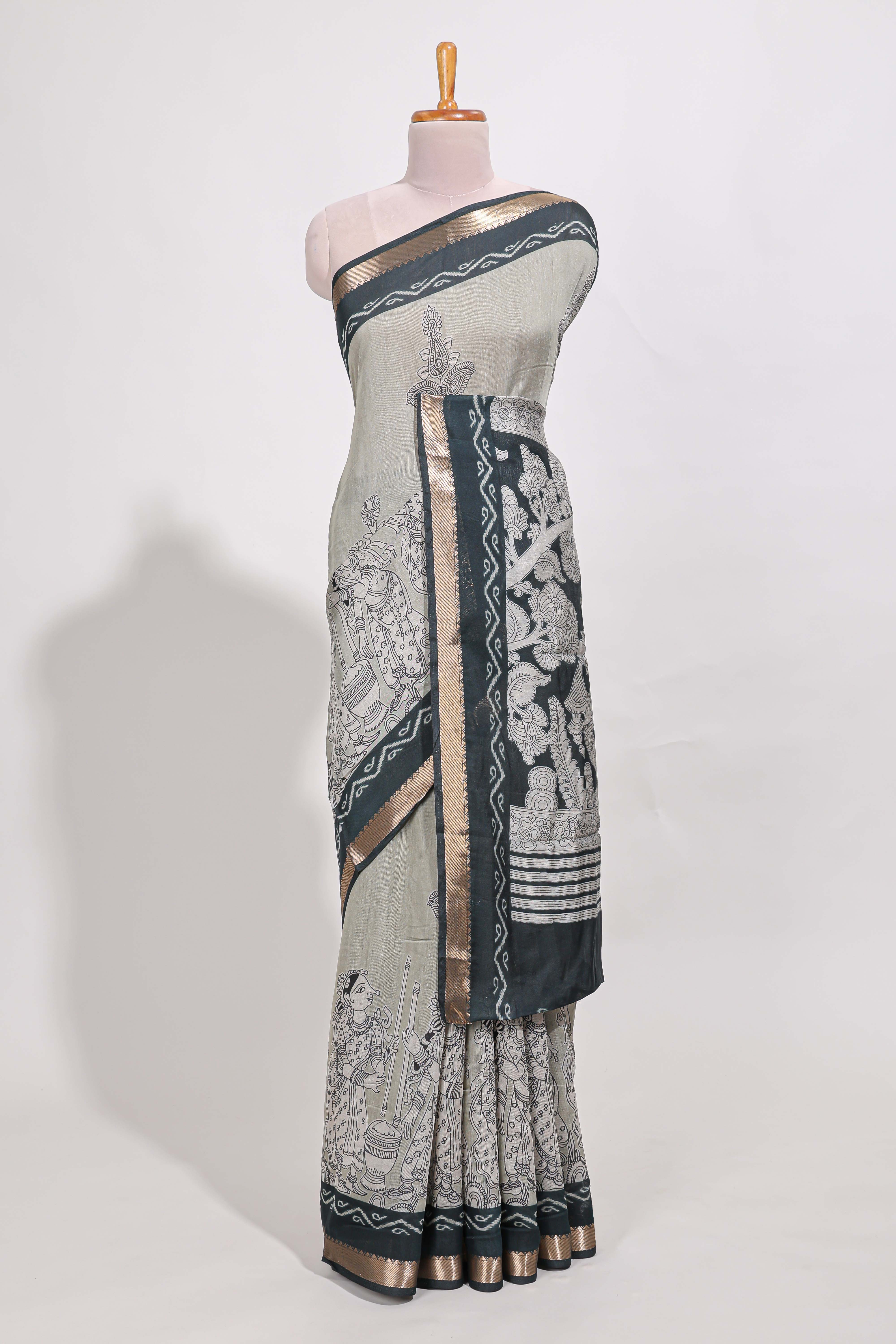 Grey colour viscose georgette saree All-over elegant ethnic detailing gold zari border and Statement pallu with artistic motifs with contrast printed blouse