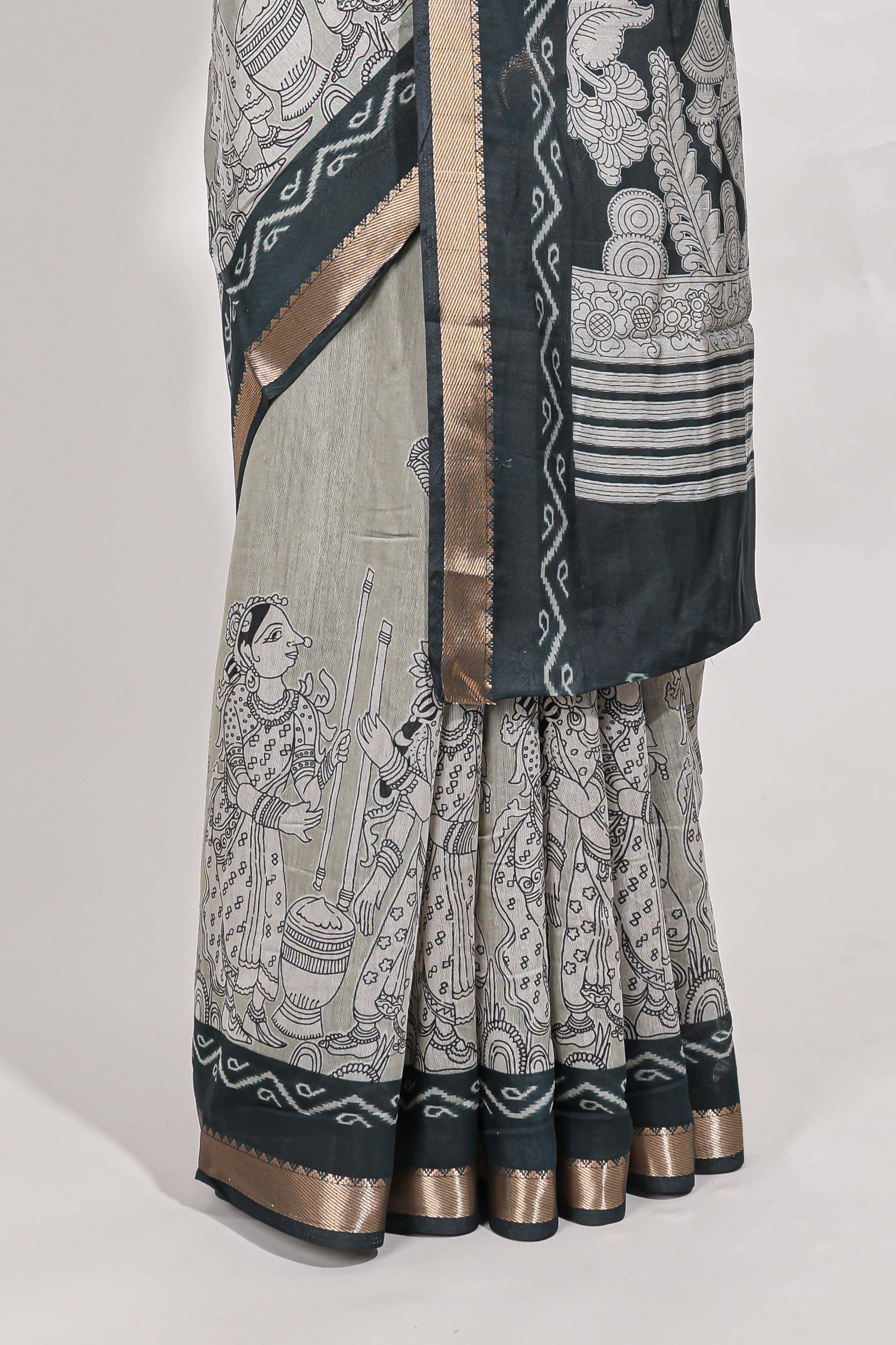 Grey colour viscose georgette saree All-over elegant ethnic detailing gold zari border and Statement pallu with artistic motifs with contrast printed blouse