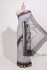 Indigo Blue colour viscose georgette saree All-over elegant ethnic detailing gold zari border and Statement pallu with artistic motifs with contrast printed blouse