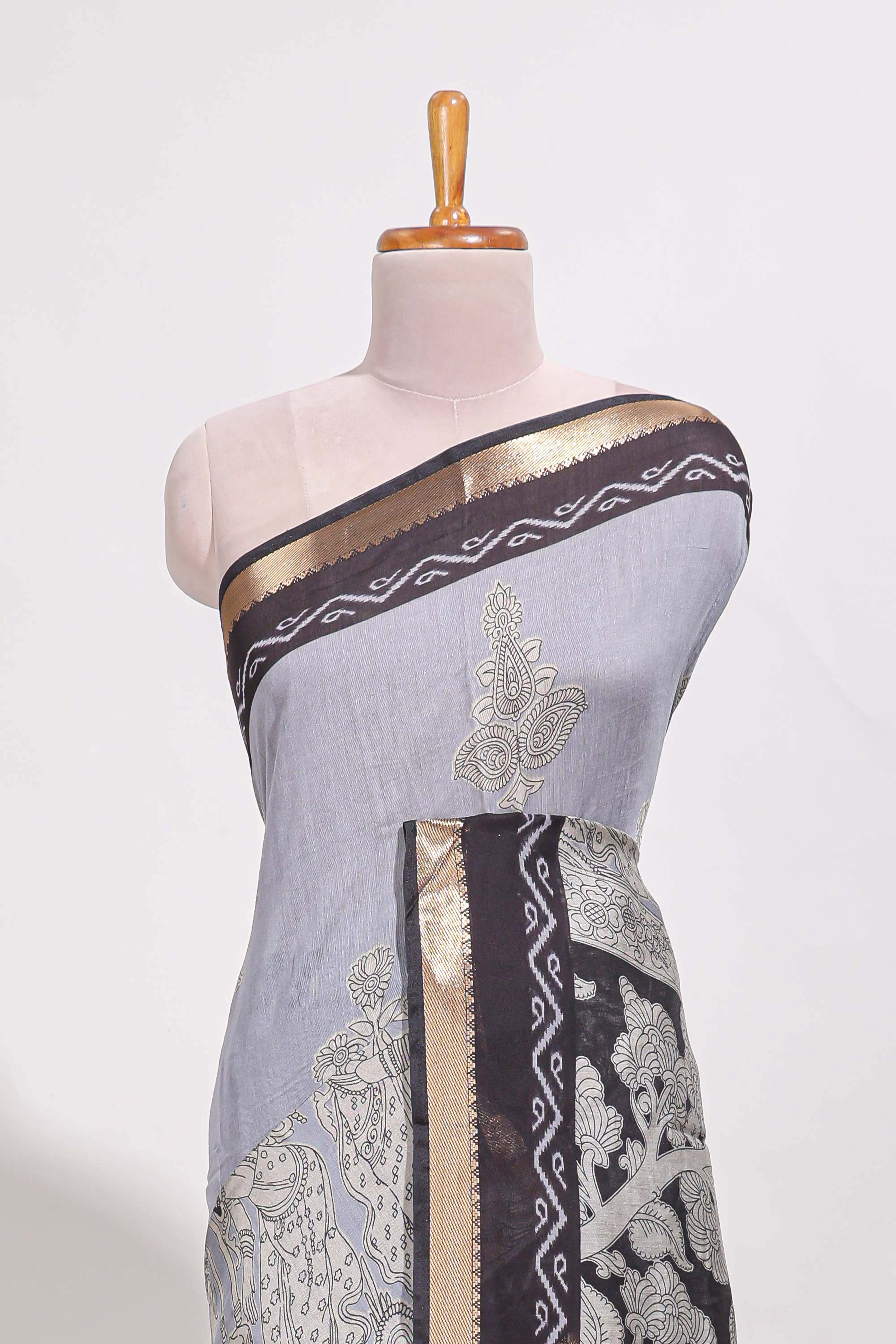 Indigo Blue colour viscose georgette saree All-over elegant ethnic detailing gold zari border and Statement pallu with artistic motifs with contrast printed blouse